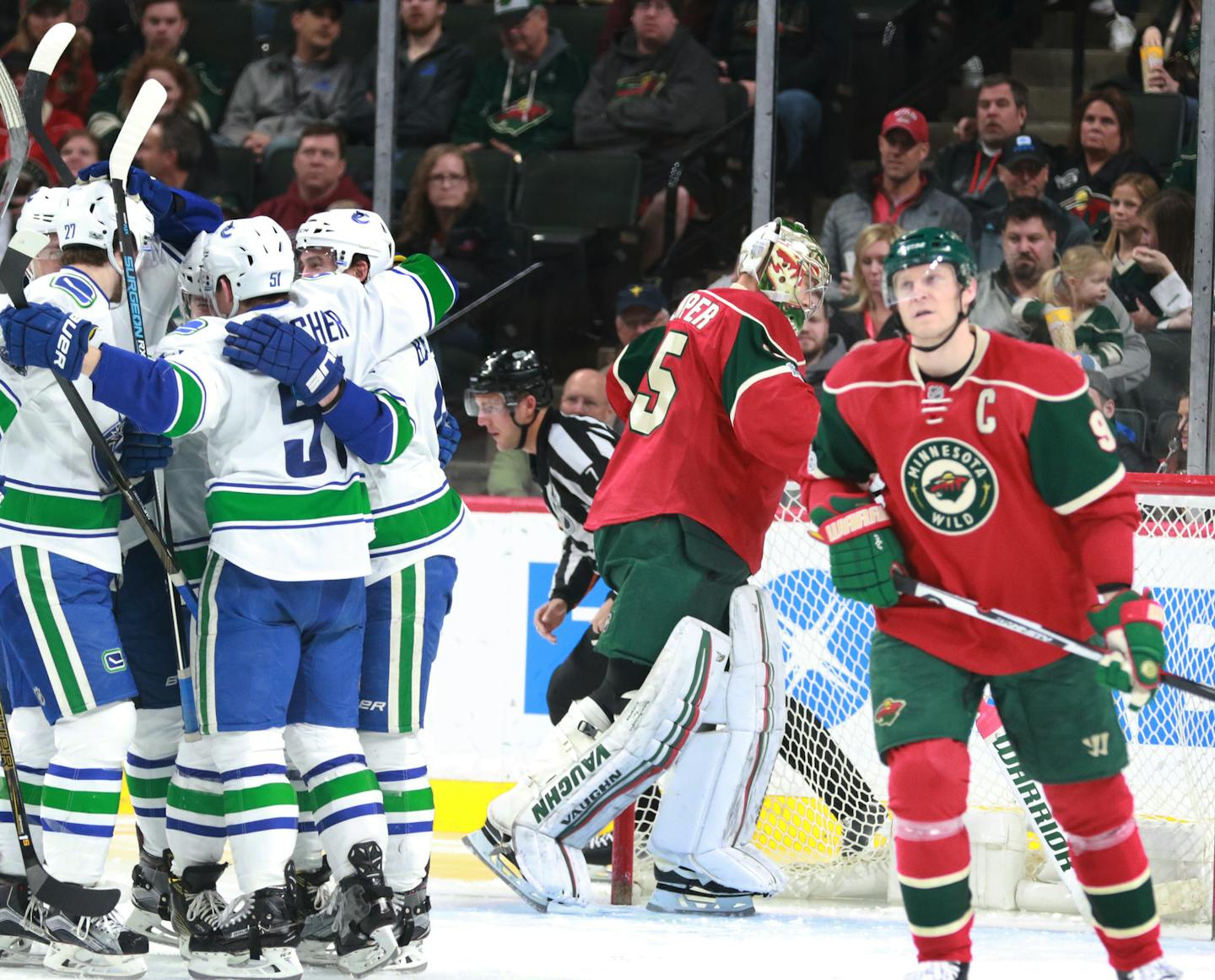 To the dismay of the Minnesota Wild's Mikko Koivu (9) and goalie Darcy Kuemper Vancouver players celebrate one of two second period goals by Reid Boucher during a Vancouver four-goal period Saturday, March 25, 2017, at the Xcel Energy Center in St. Paul, MN. Vancouver won 4-2.] DAVID JOLES &#xef; david.joles@startribune.com Vancouver at the Minnesota Wild during the 1st period Saturday, March 25, 2017, at the Xcel Energy Center in St. Paul, MN.