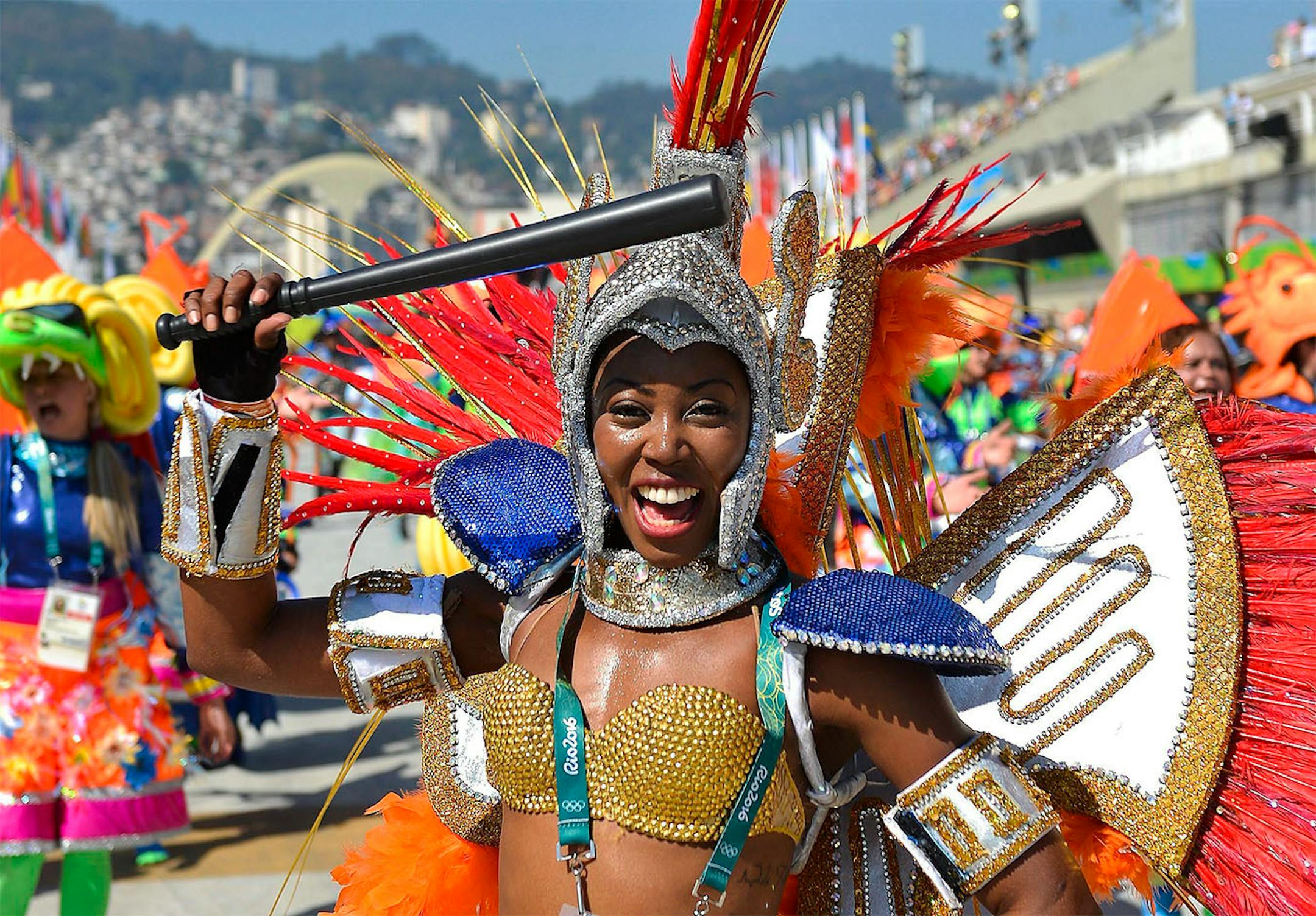 One of the samba dancers performs prior to the start of women's Marathon race of the Rio 2016 Olympic Games Athletics o in Rio de Janeiro, Brazil, Sunday, Aug. 14, 2016.