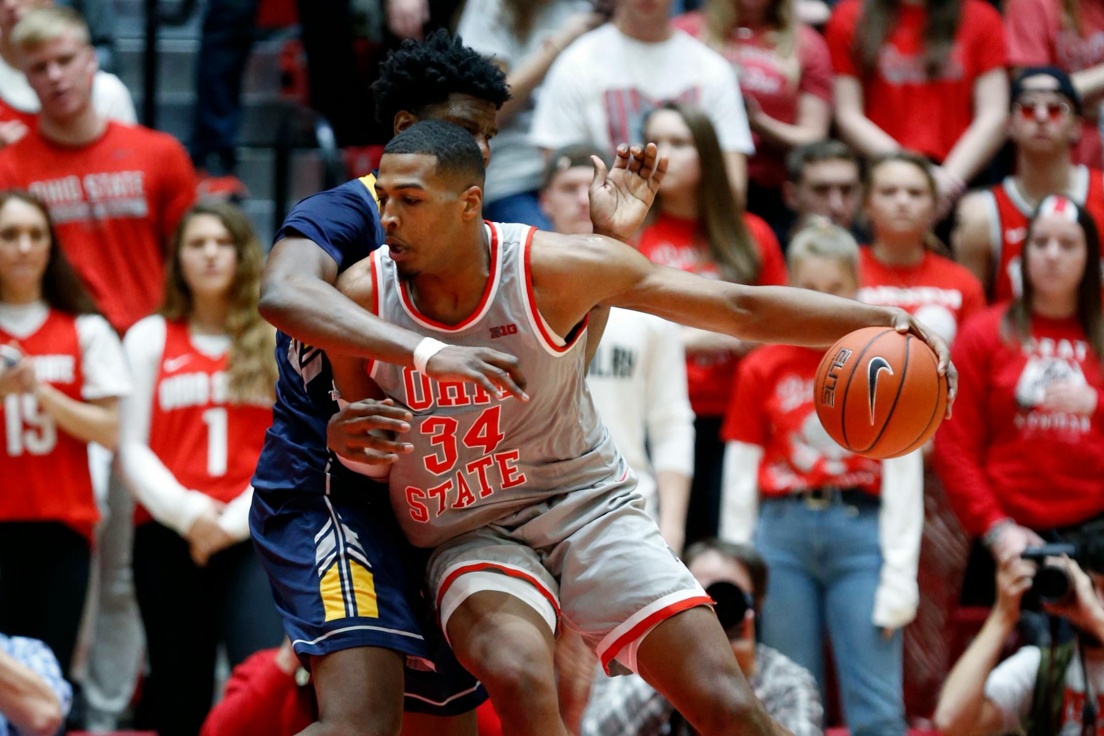 Ohio State forward Kaleb Wesson, right, drives in front of Kent State forward Phil Whittington during an NCAA college basketball game in Columbus, Ohio, Monday, Nov. 25, 2019. Ohio State won 71-52. (AP Photo/Paul Vernon)