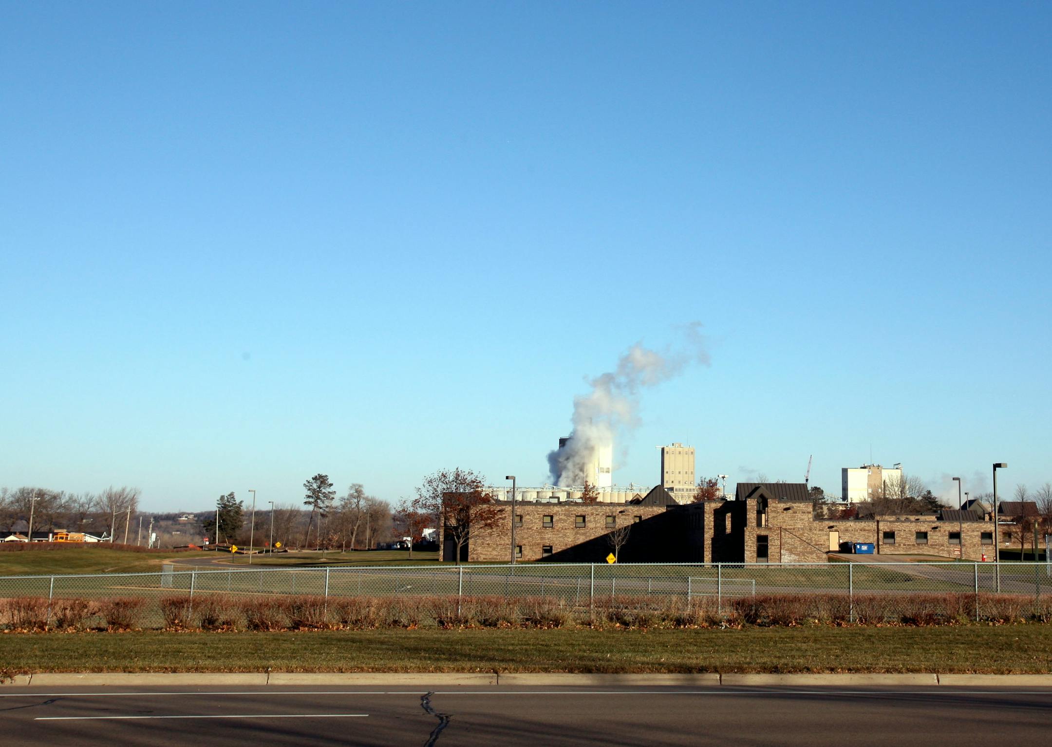 The Shakopee women's prison has some temporary construction fencing and hedges, but officials want to add one 10 to 12 feet high around the property.
