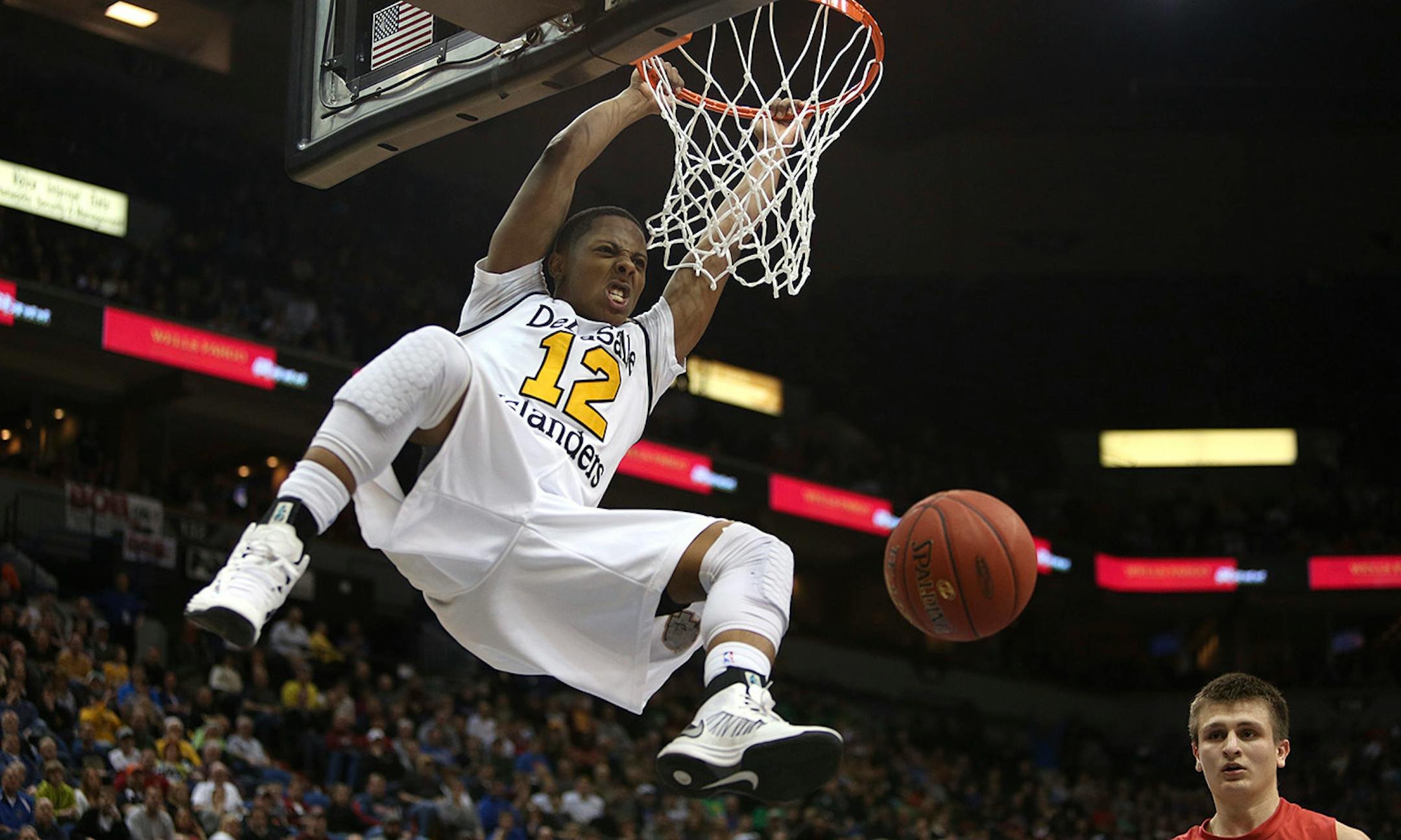 DeLaSalle's Jarvis Johnson dunked the ball during the second half of the class 3A championship at the Target Center in Minneapolis, Min., Saturday, March 23, 2013. DeLaSalle won over Austin 50-33. ] (KYNDELL HARKNESS/STAR TRIBUNE) kyndell.harkness@startribune.com