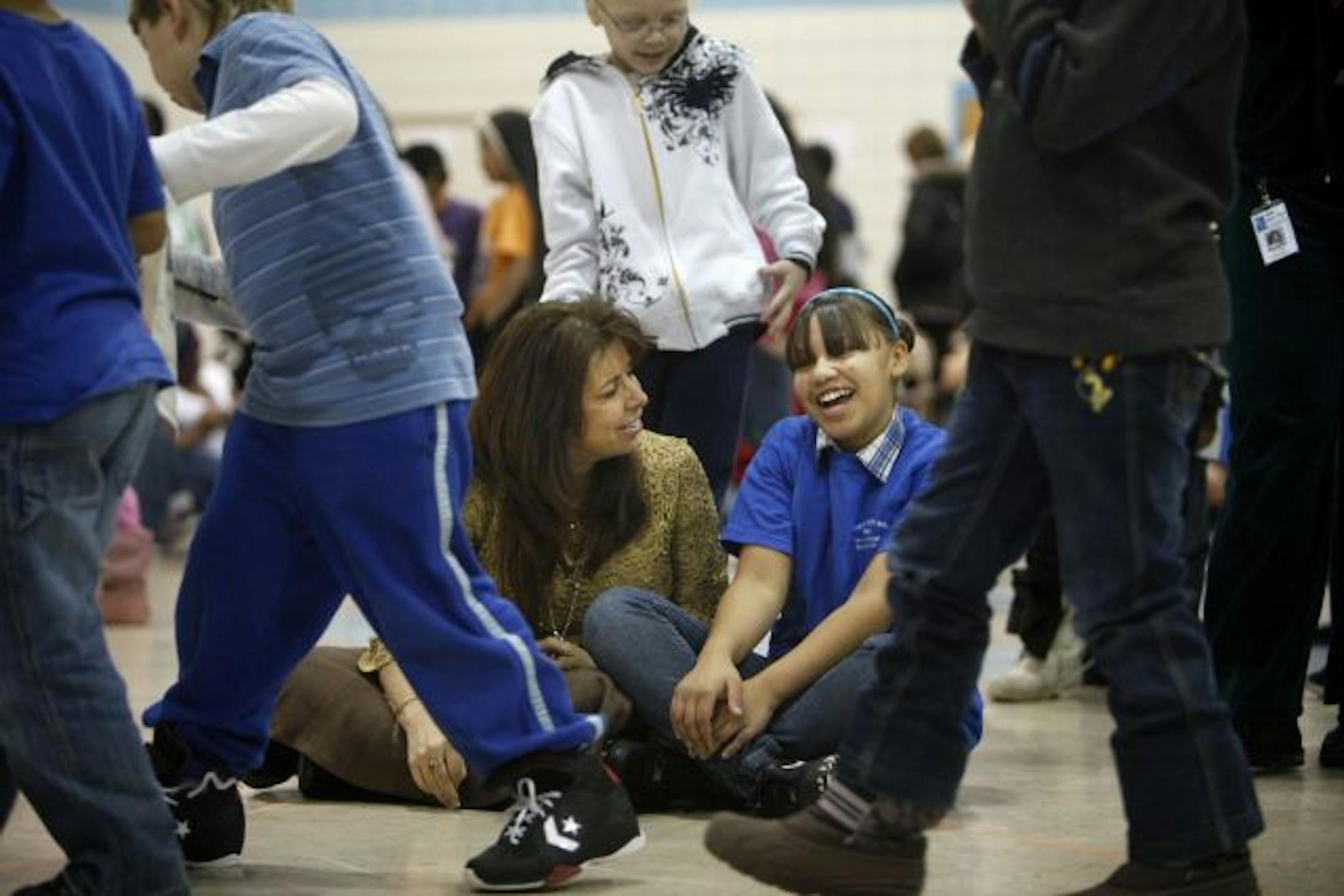 St. Paul superintendent Valeria Silva chatted with Tamona Williams at Eastern Heights Elementary School. Silva has known the sixth-grader for three years.