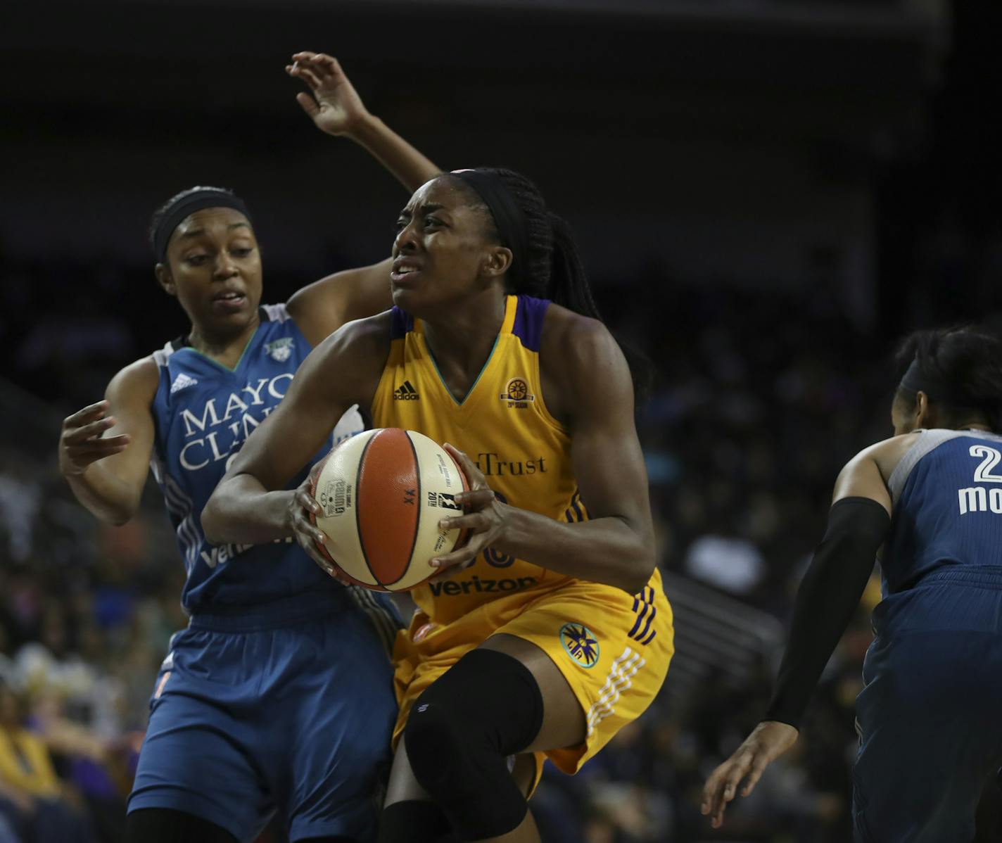 Los Angeles Sparks forward Nneka Ogwumike (30) drove between Minnesota Lynx guard Renee Montgomery (21) and Minnesota Lynx forward Maya Moore (23) in the fourth quarter. ] JEFF WHEELER &#xef; jeff.wheeler@startribune.com The Minnesota Lynx lost to the Los Angeles Sparks 92-75 in Game 3 of their WNBA Finals series Friday night, October 14, 2016 at the Galen Center in Los Angeles.