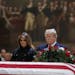 President Donald Trump and first lady Melania Trump have a moment of silence at the flag-draped casket of former President George H.W. Bush in the Rot