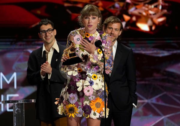 Taylor Swift accepts the award for album of the year for "Folklore"at the 63rd annual Grammy Awards at the Los Angeles Convention Center on Sunday, Ma