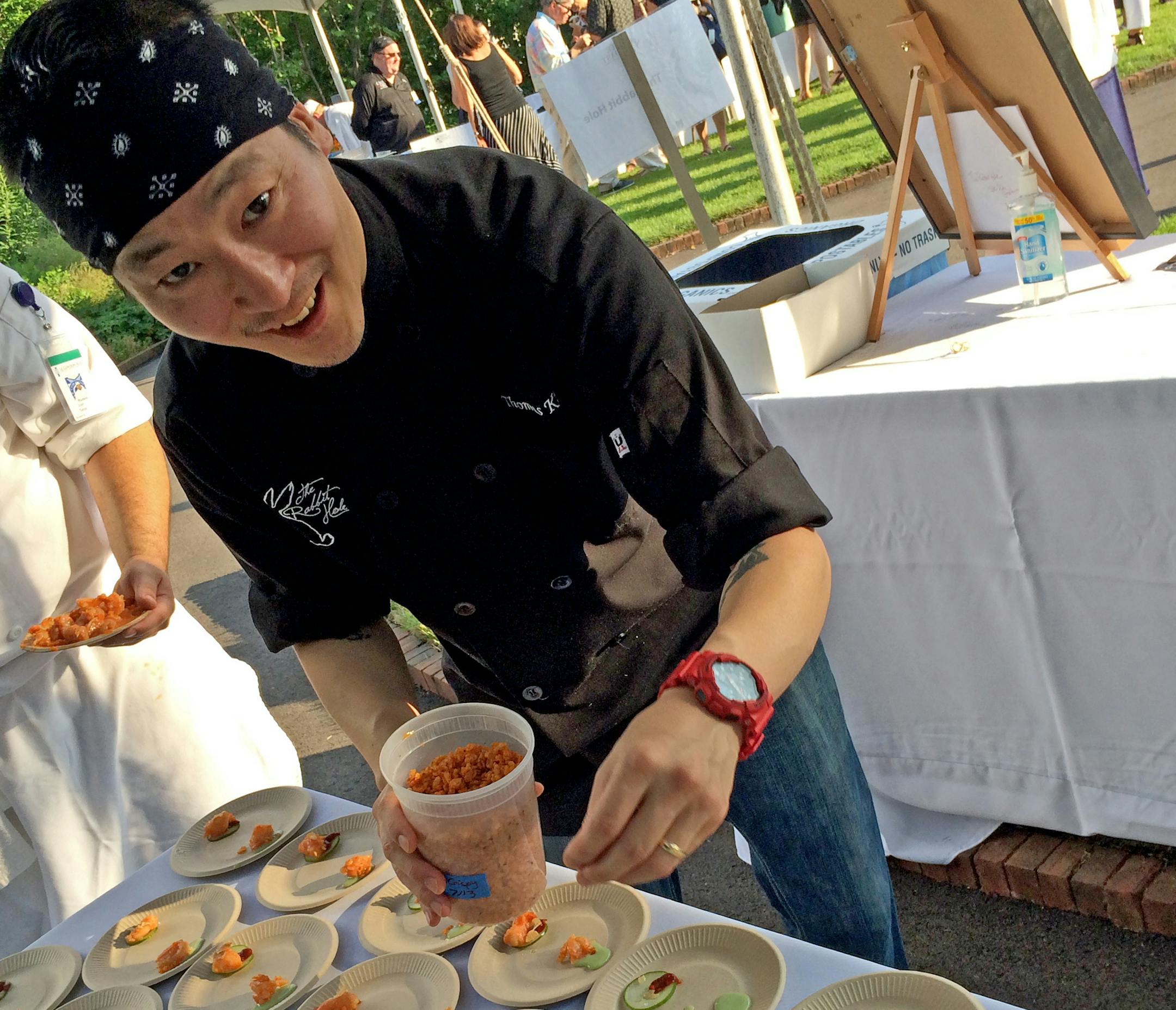 Minnesota Landscape Arboretum made the perfect setting for the annual Taste and Toast fundraising event. Thomas Kim of the Rabbit Hole puts the finishing touches on an appetizer.