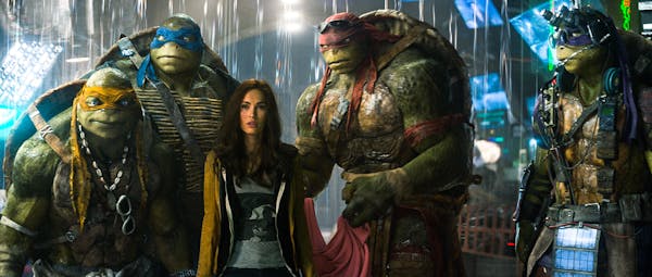 This image released by Paramount Pictures shows, from left, Michelangelo, Leonardo, Megan Fox, as April O'Neil, Raphael, and Donatello in a scene from