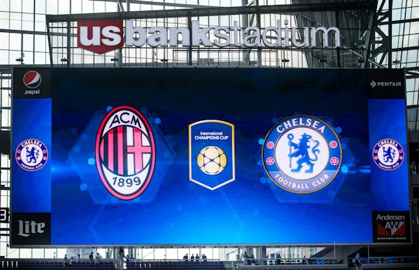 The Chelsea FC and AC Milan team logos were presented on the video displays Tuesday night at US Bank Stadium as fans watched Chelsea FC's practice fro