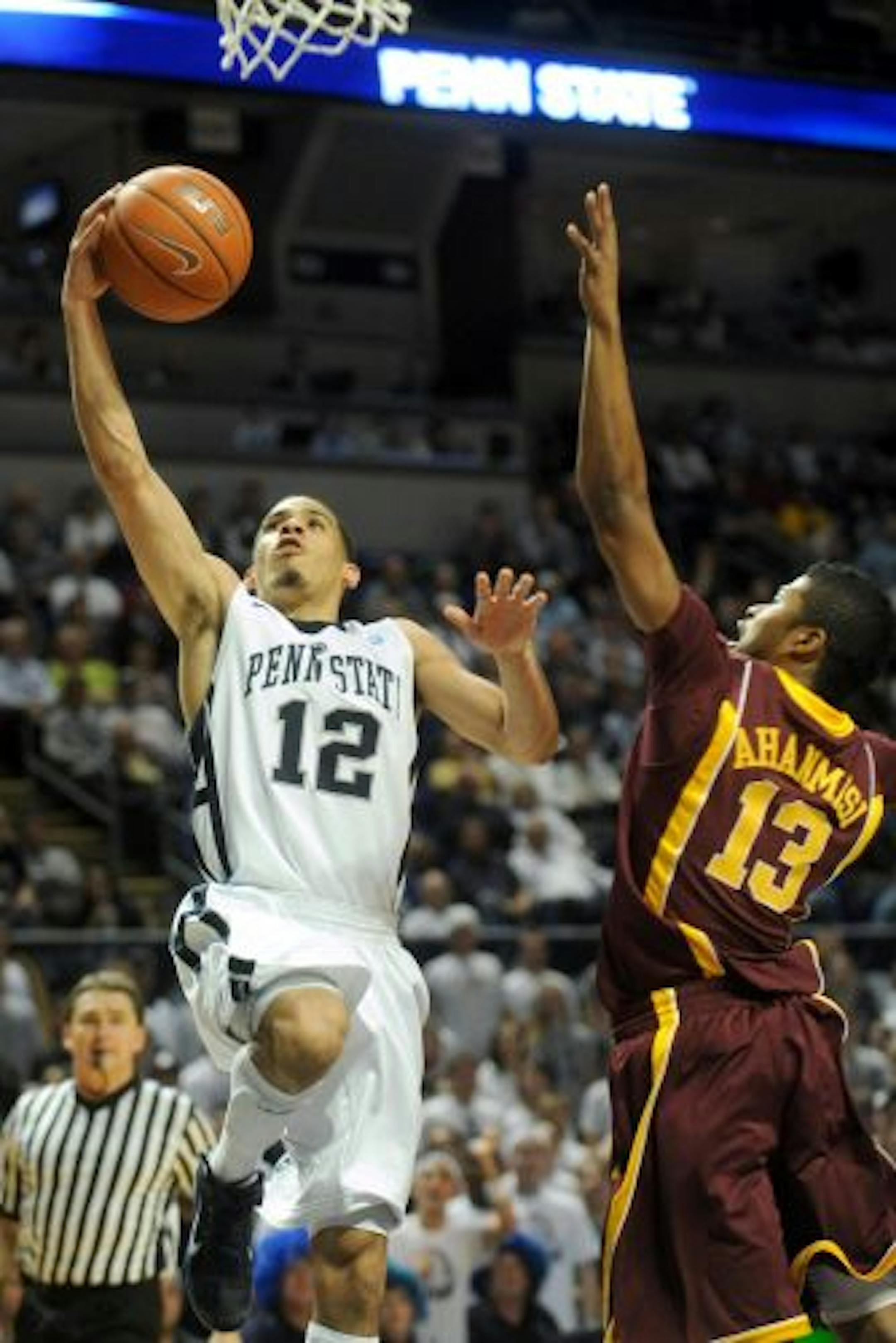 Penn State senior Talor Battle went past the Gophers' Maverick Ahanmisi for a layup on his way to 28 points Thursday night.