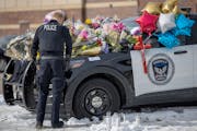 Members of the Eden Prairie Police Department paid their respects on three memorials in front of the Burnsville Police Department on Monday.