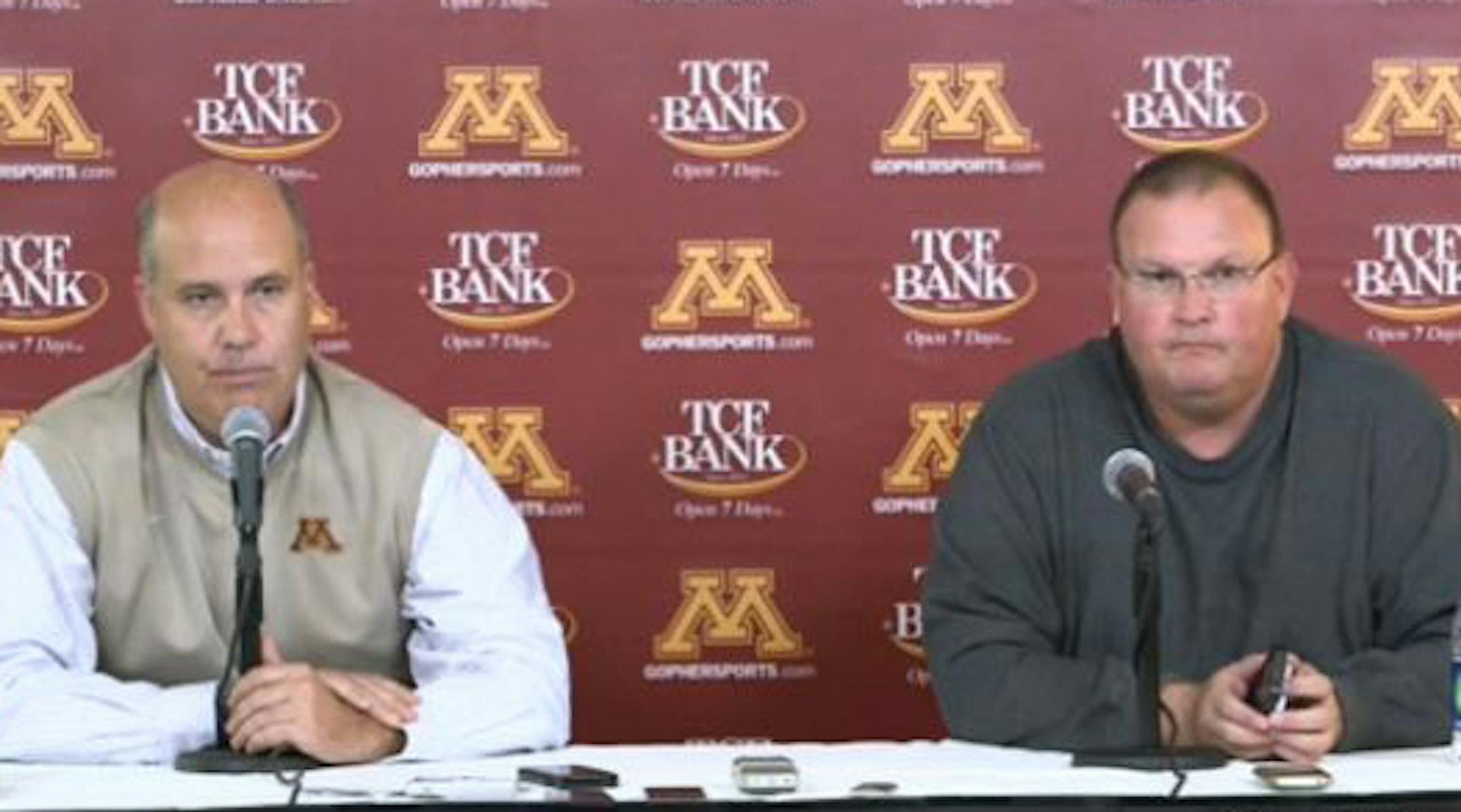 News conference about Coach Jerry Kill's leave. Athletic director Norwood Teague (left) and acting coach Tracy Claeys (right)