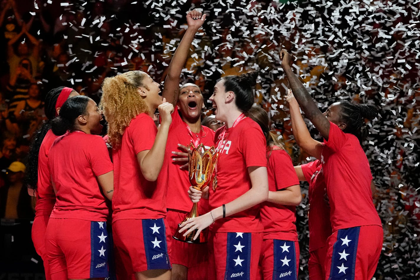 The United States hold their trophy as they celebrate on the podium after defeating China in the gold medal game at the women's Basketball World Cup in Sydney, Australia, Saturday, Oct. 1, 2022. (AP Photo/Mark Baker)