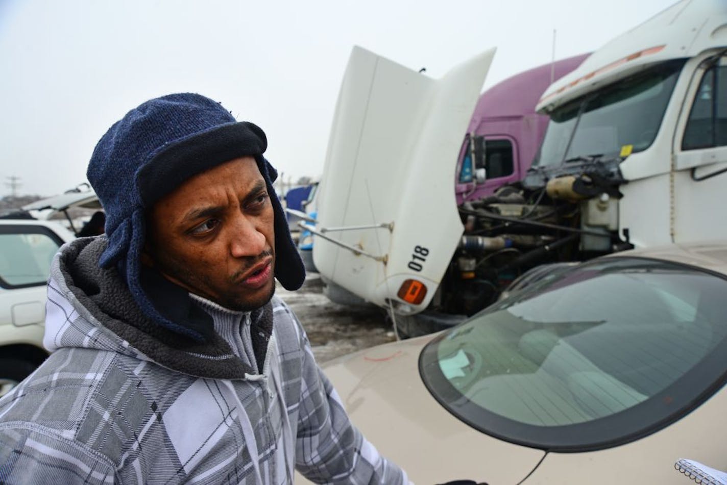 Girmachew Bezabin owns his own trucking company and was working on one of his trucks in the lot at Stockmen's Truck Stop.