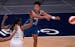 Minnesota Lynx guard Layshia Clarendon (7) made a no-look pass as Las Vegas Aces guard Riquna Williams (2) defended during the first quarter.