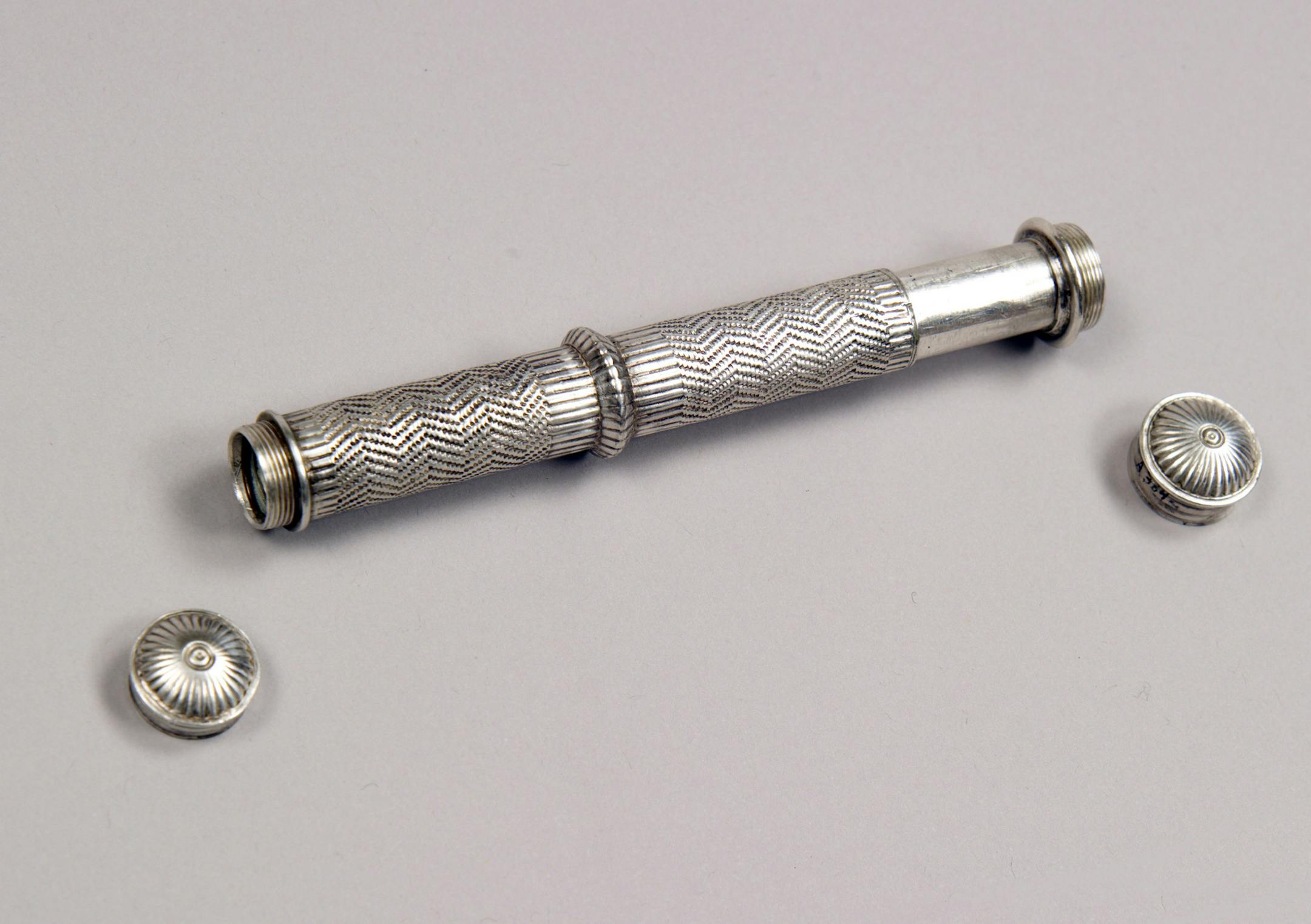 In this June 24, 2008, photo provided by the Adler Planetarium in Chicago, a five inch long telescope from the collection of Marvin Bolt in shown. Bolt, the science and technology curator at New York’s Corning Museum of Glass is on a worldwide quest to track down the oldest telescopes known to man, including those dating to the early 1600s and the days of Galileo. (AP Photo/Adler Planetarium, Steve Pitkin)