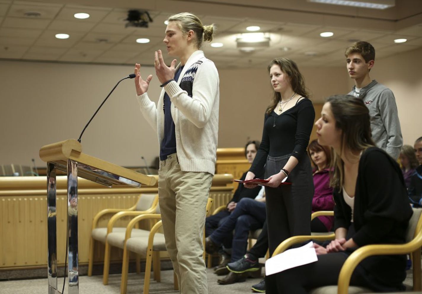 St. Louis Park High School Roots and Shoots members Owen Geier, Sophia Skinner, Jayne Stevenson, and Lukas Wrede, from left, each addressed the St. Louis Park City Council Monday night.