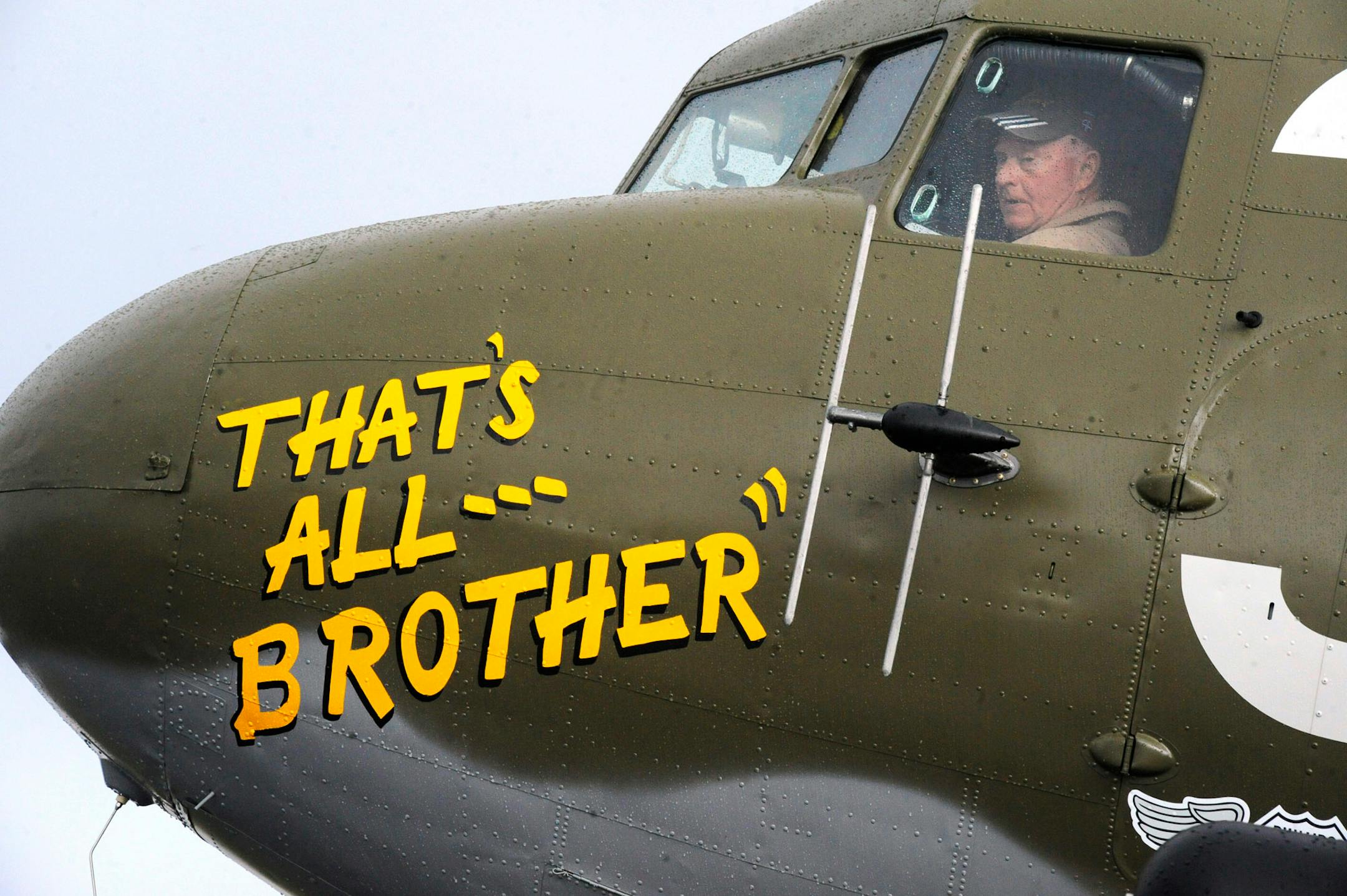 In this April 9, 2019, photo, Pilot Tom Travis sits in the cockpit of the World War II troop carrier That's All, Brother during a stop in Birmingham, Ala. The C-47 aircraft, which led the main Allied invasion of Europe on June 6, 1944, is returning to the continent to participate in events marking the 75th anniversary of D-Day in June.