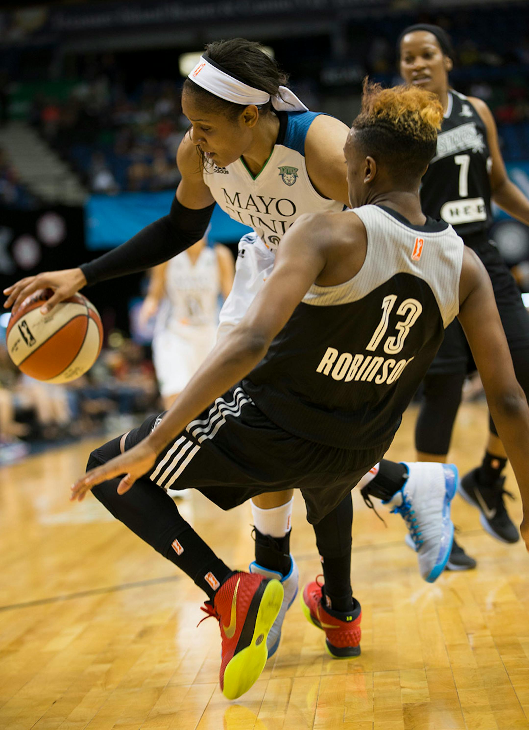 Lynx Maya Moore collided with San Antonio's Danielle Robinson in the second half. Moore score 24 points in the second half.