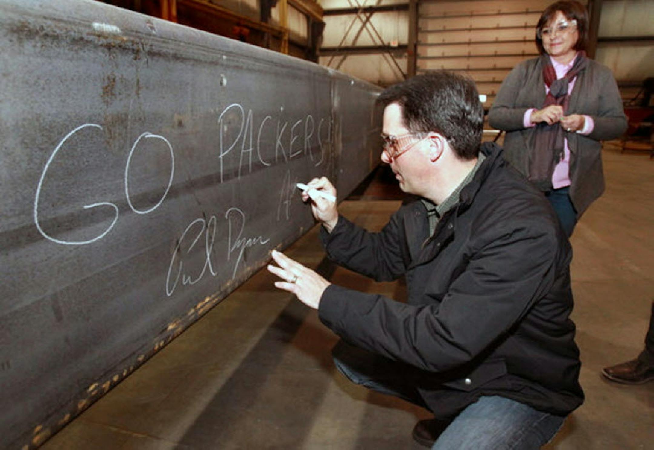 Gov. Scott Walker, during a campaign stop last week in West Salem, sneaked a "Go Packers" message on a beam meant for the Vikings Stadium. With Walker on this stop was Lt. Gov. Rebecca Kleefisch. U.S. Rep. Paul Ryan, on the same campaign stop, also signed the beam.