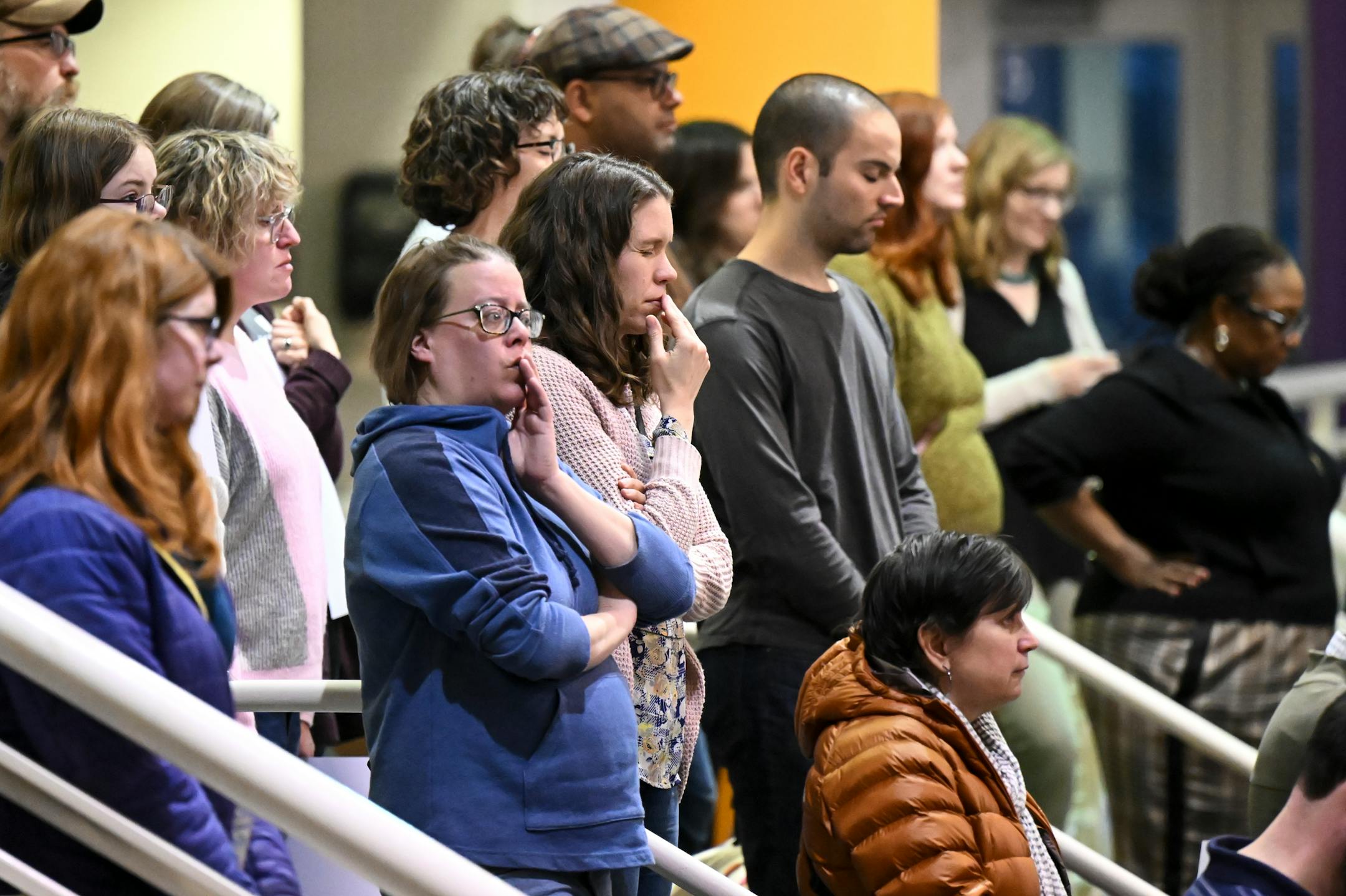 Community members took a moment of silence for students killed in violence.