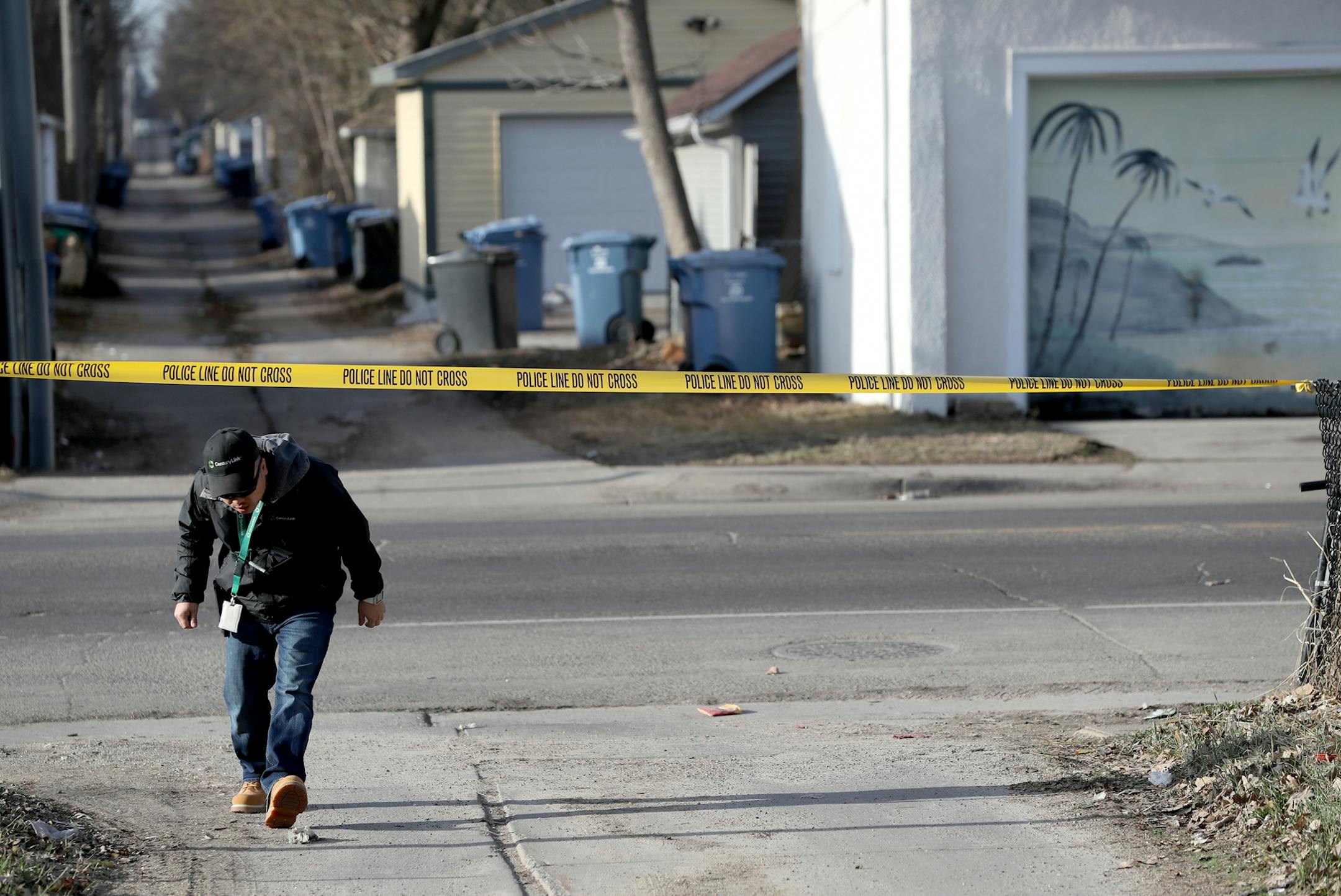 Police tape lines the alley behind 1900 Newton Ave. N. near where police, shortly after 5 a.m., found a man lying in the street with a gunshot wound and was transported to North Memorial Medical Center where he later died Thursday, April 26, 2018, in Minneapolis, MN.
