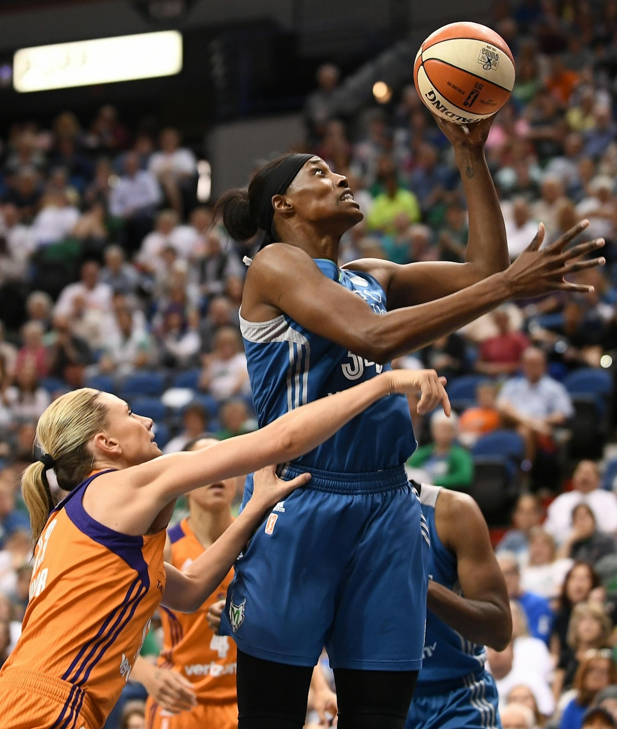 Phoenix Mercury forward Penny Taylor (13) fouled Minnesota Lynx center Sylvia Fowles (34) for an and-1 opportunity in the second quarter Tuesday.