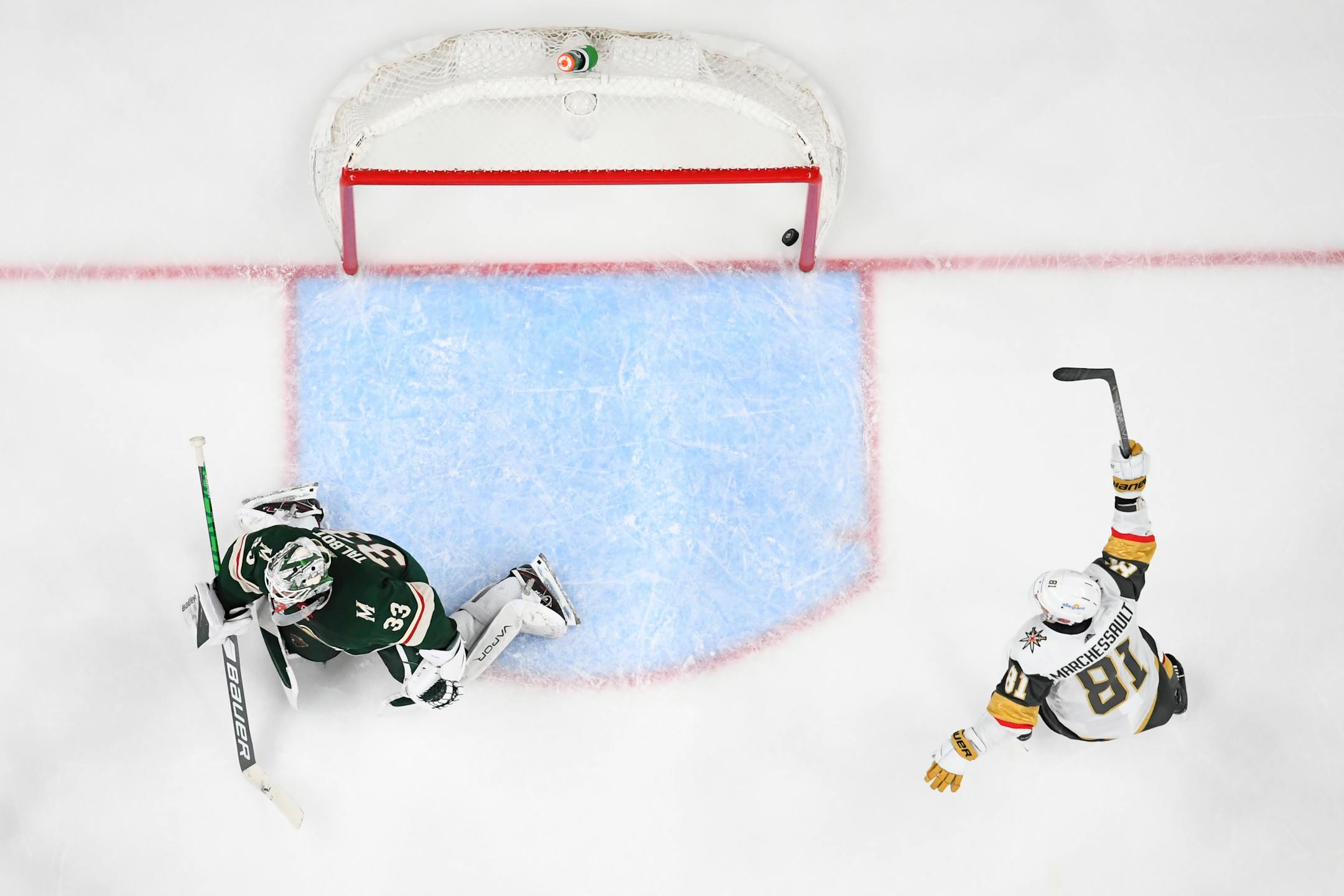 Vegas Golden Knights center Jonathan Marchessault (81) celebrated after a goal by center Mattias Janmark (26) against Minnesota Wild goaltender Cam Talbot (33) late in the third period.