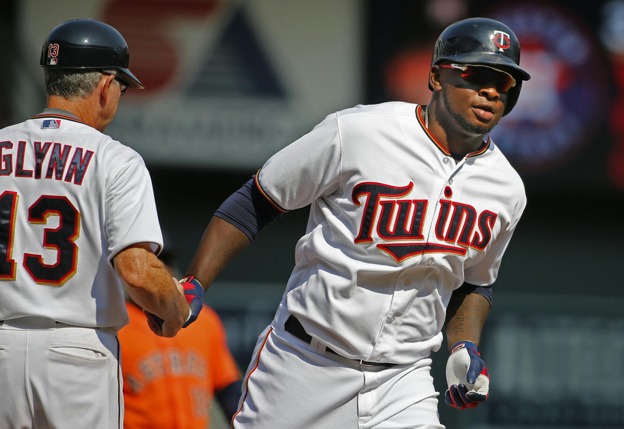 Miguel Sano(22) homers in the7th inning, scoring two runs as he rounded third base and is congratulated by coach Gene Glynn.] At the Twins vs Astros game at Target Field on 8/30/2015Richard Tsong-Taatarii/rtsong-taatarii@startribune.com