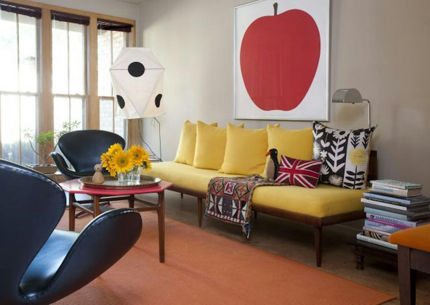 The Edina townhouse of David Anger and Jim Broberg is filled with Danish modern furniture and bold retro art work.