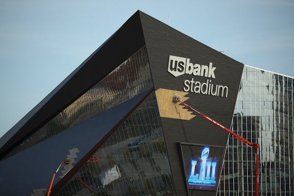 Construction workers attended to panels on the exterior of U.S. Bank Stadium Tuesday evening. ] JEFF WHEELER � jeff.wheeler@startribune.com The Minn