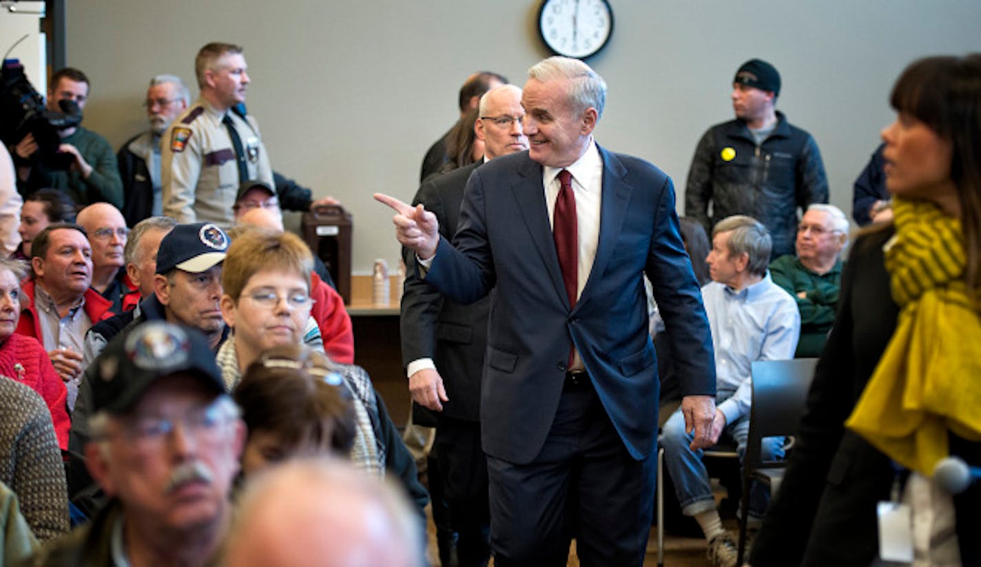 Governor Mark Dayton took questions from a standing room only crowd of a couple hundred people in his first 'Meeting with Mark' in a town hall meeting in Duluth to talk about his budget proposal.   Wednesday, March 20, 2013. Behind him is Revenue Commissioner Myron Frans.   ]   GLEN STUBBE * gstubbe@startribune.com