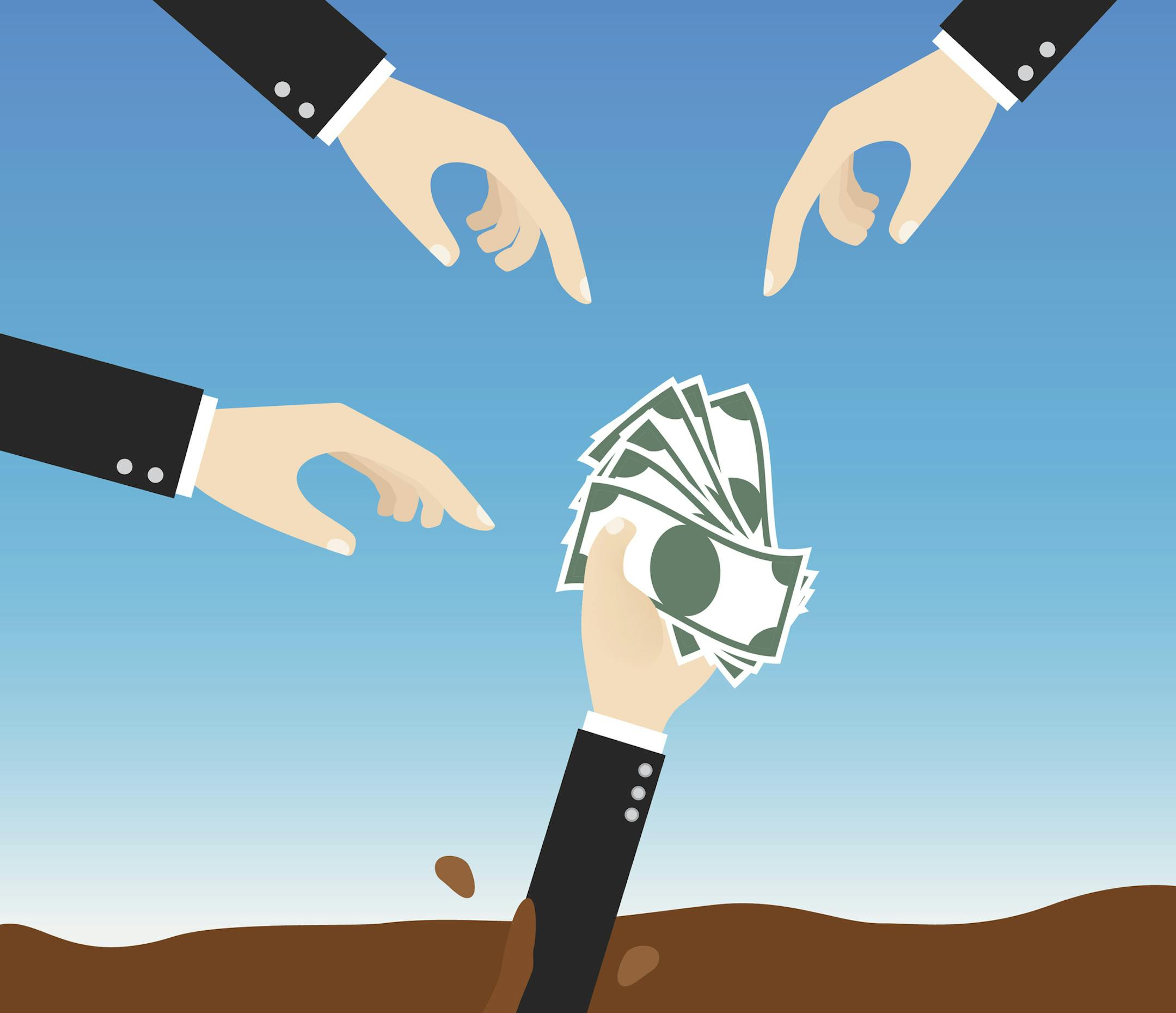 businessman holding money sinking in quicksand need help with rescue hand