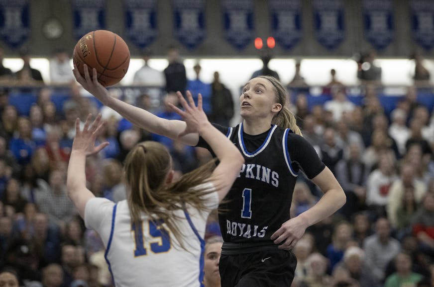 Hopkins' Paige Bueckers went up for two and drew a foul from Wayzata's Lydia Hay during the second half of their match up in the Class 4A, Section 6 girls' basketball championship at the Lindbergh Center, Thursday, March 5, 2020 in Hopkins, MN.