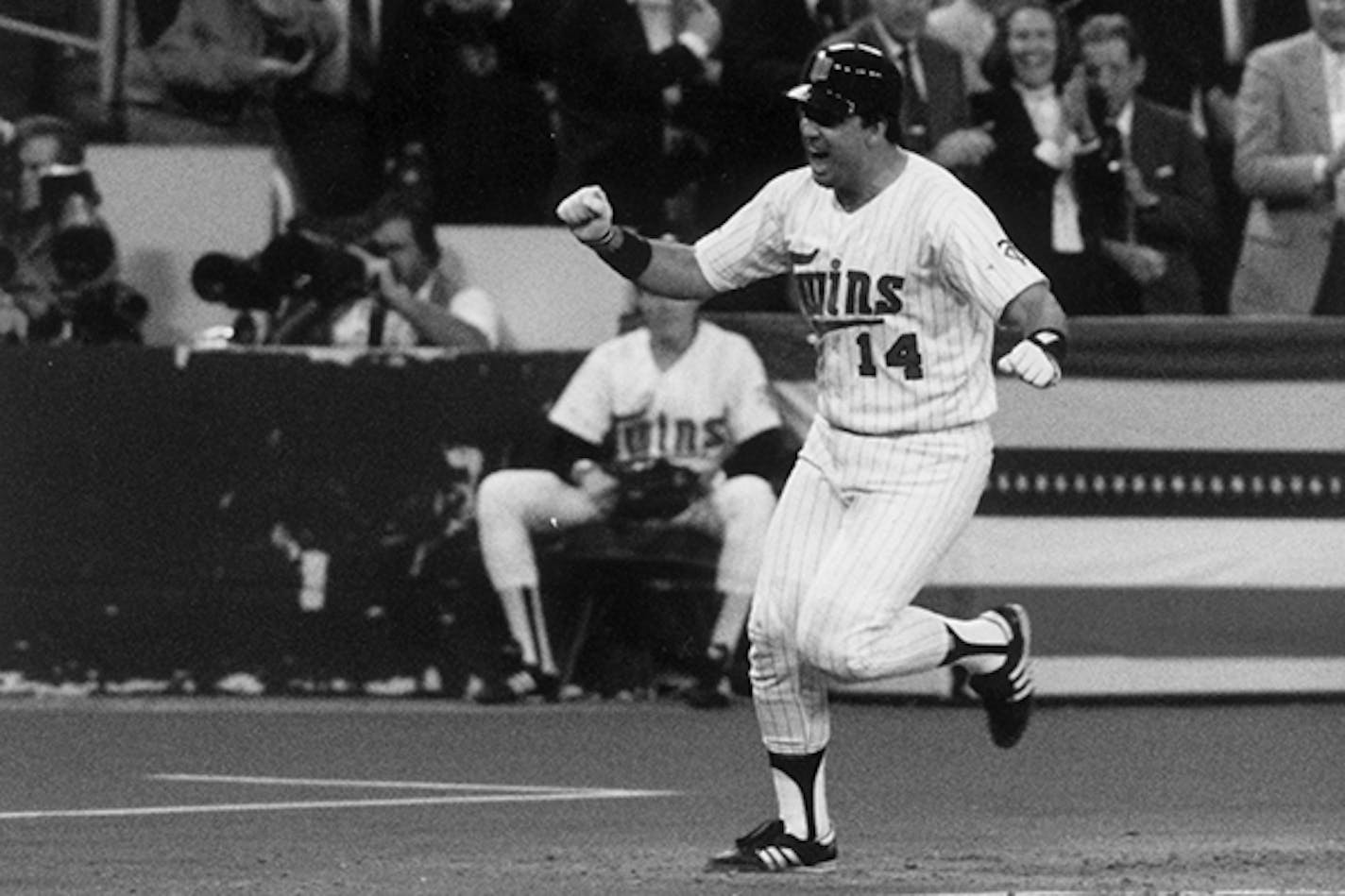 Kent Hrbek celebrates his grand slam against St. Louis during the 1987 World Series.