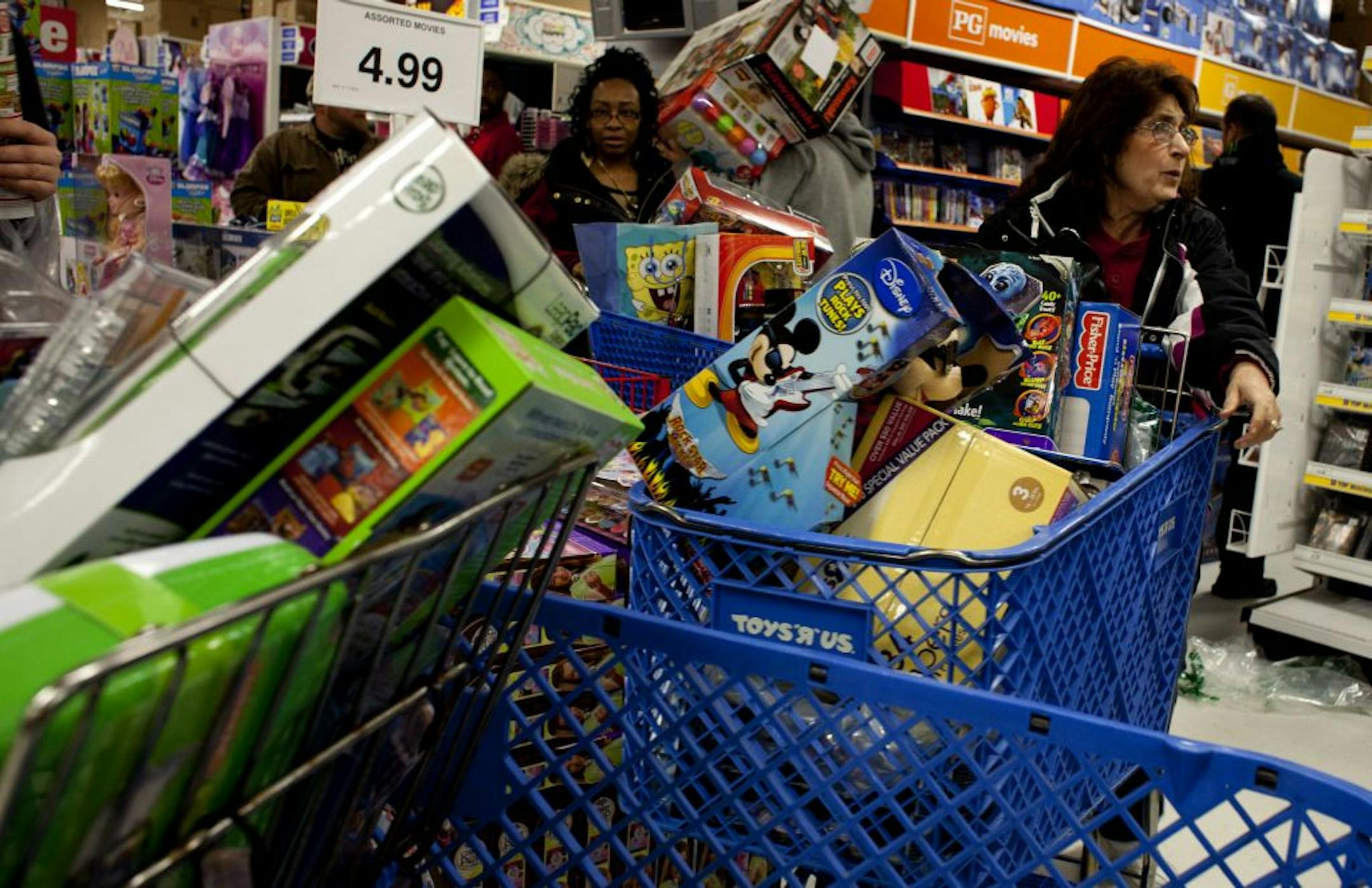 Toys R Us is using a host of strategies this holiday season as it battles other toymakers and strives to generate the kind of business that its store in Saginaw Township, Mich., had on Black Friday.