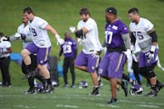 Riley Reiff, center, took to the field for practice at Winter Park, Wednesday, June 14, 2017 in Eden Prairie, MN.
