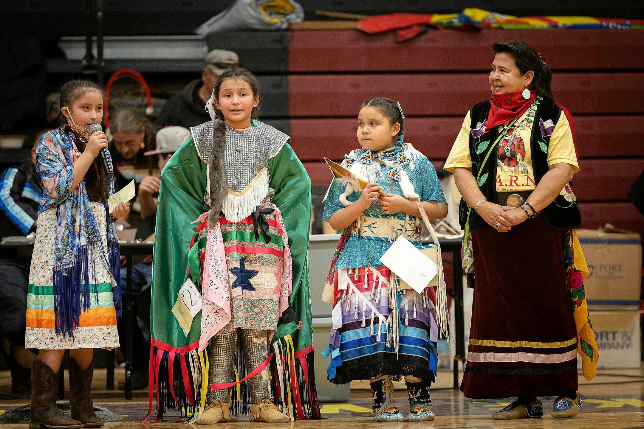 American Indian Movement Minnesota director Lisa Bellanger, right, asks questions to young dancers for the princess competition during a Pow Wow to honor the AIM Warriors of Wounded Knee of 1973 in Wanblee, SD on the Pine Ridge Indian Reservation.