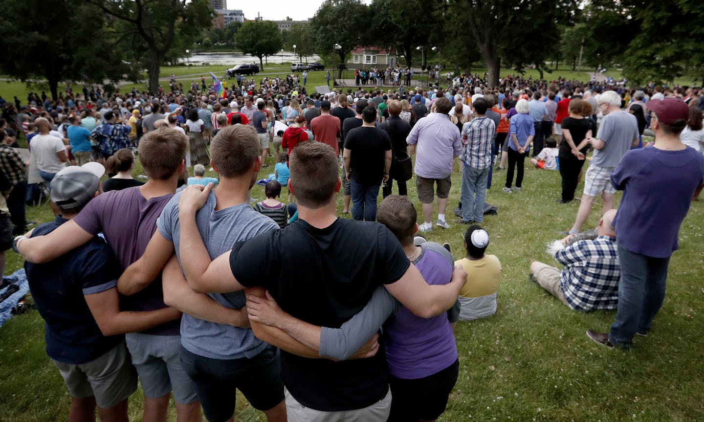 The crowd listened to speakers at a vigil held at Loring Park for the victims of the Orlando shooting. ] CARLOS GONZALEZ cgonzalez@startribune.com - June 12, 2016, Minneapolis, MN, Vigil at Loring Park, Join community as we gather to unite in the wake of the Orlando, FL shooting of at least 50 LGBTQA community members. ORG XMIT: MIN1606122126551144