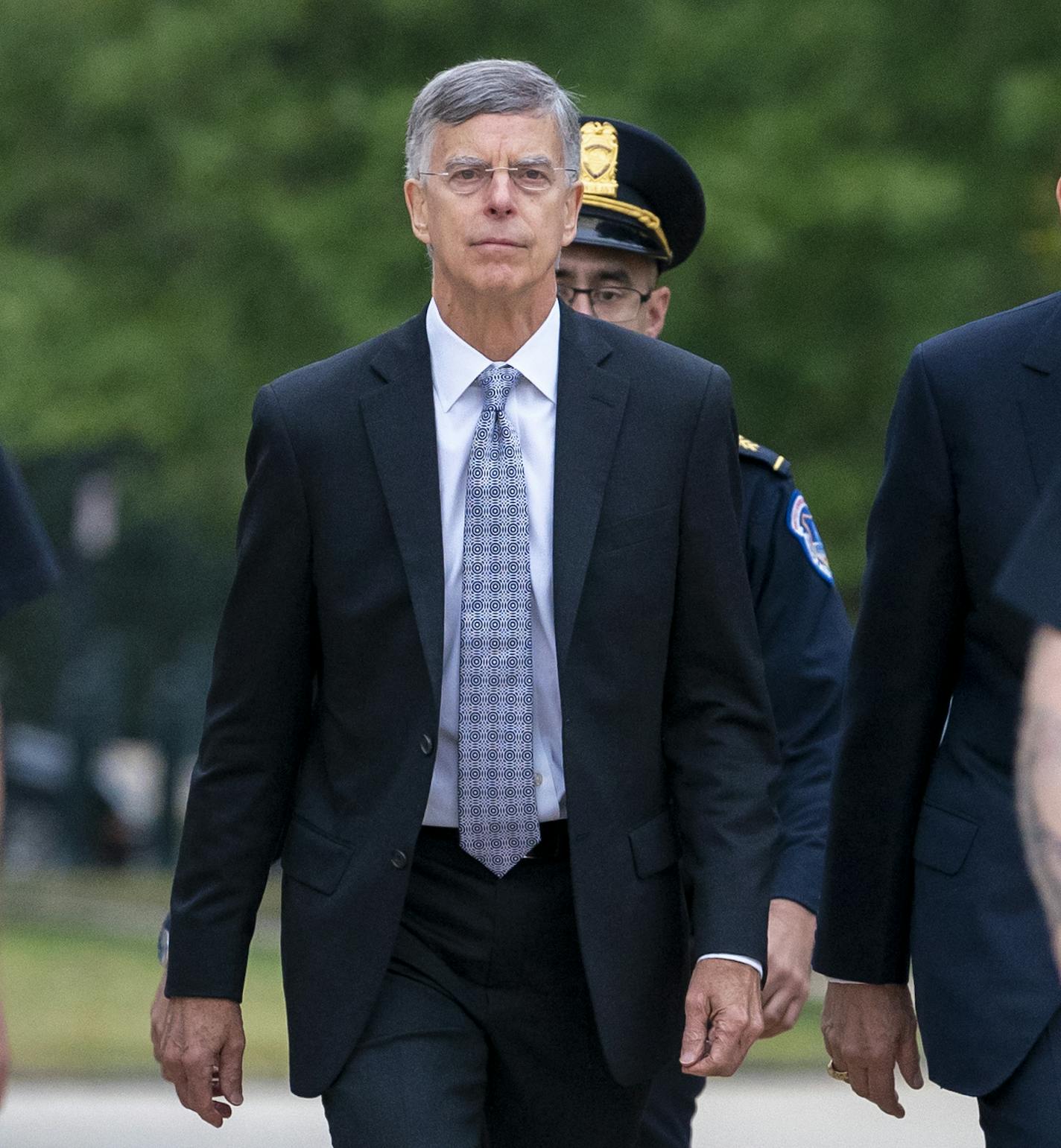 Ambassador William Taylor, is escorted by U.S. Capitol Police as he arrives to testify before House committees as part of the Democrats' impeachment investigation of President Donald Trump, at the Capitol in Washington, Tuesday, Oct. 22, 2019. (AP Photo/J. Scott Applewhite)