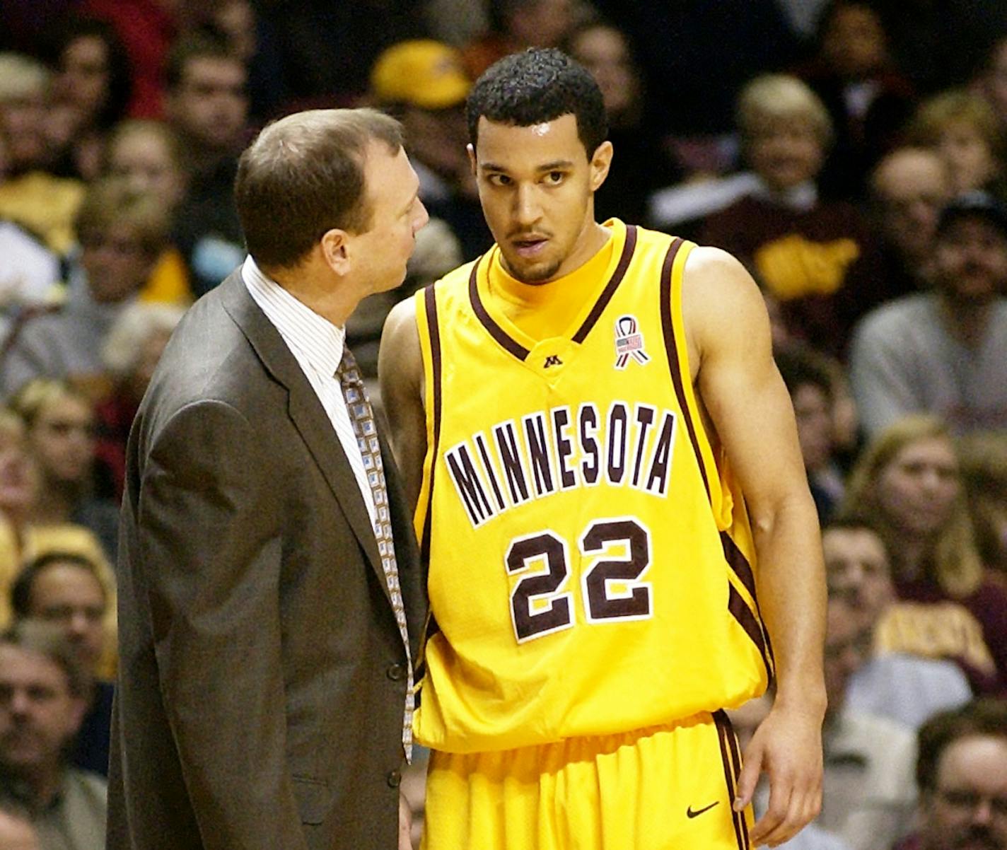 Minnesota head coach Dan Monson, left, talks with guard Ben Johnson in the second half against Western Illinois, Saturday, Dec. 6, 2003, in Minneapolis. Johnson had a game-high 23 points as Minnesota won, 86-64. (AP Photo/Tom Olmscheid)