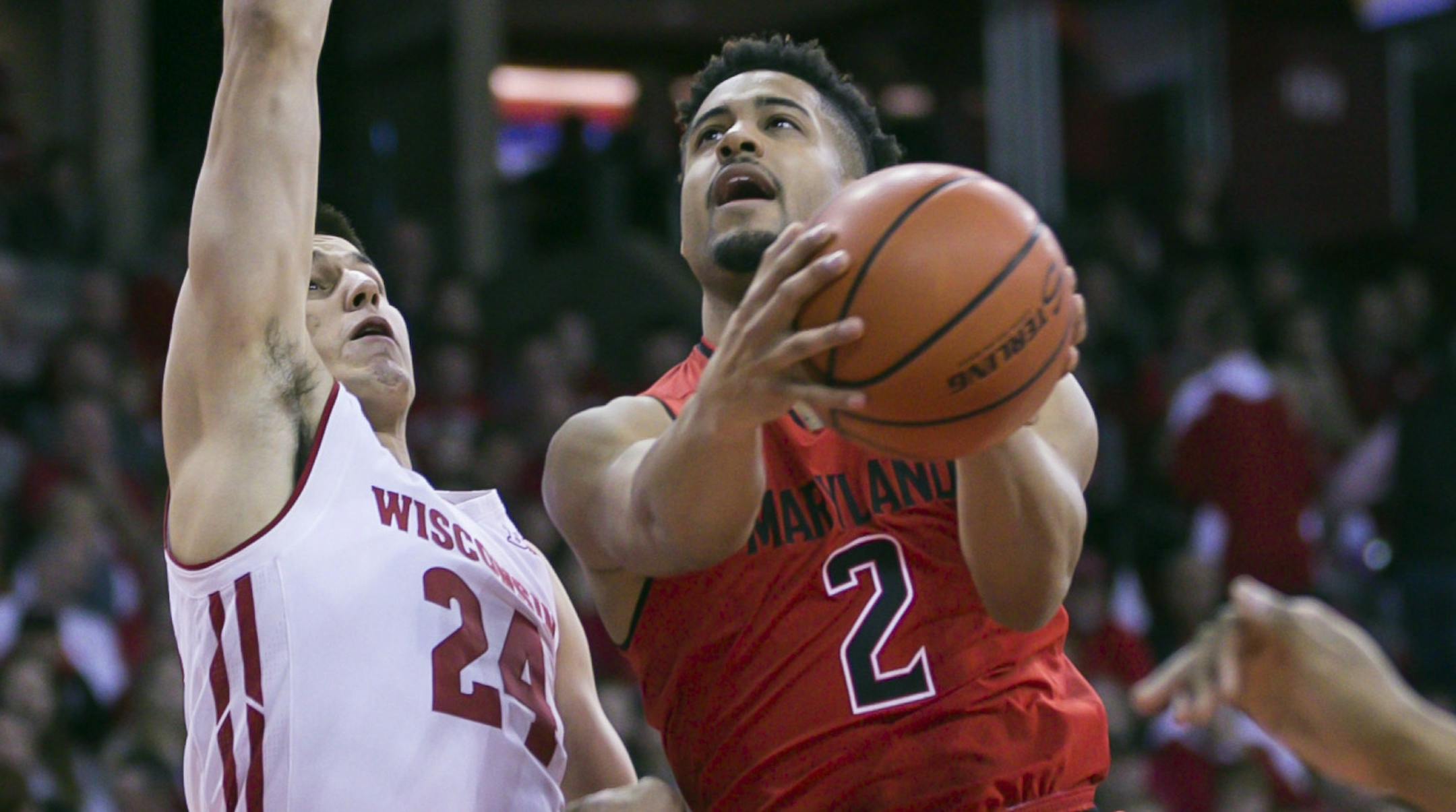 Maryland's Melo Trimble (2) shoots against Wisconsin's Bronson Koenig (24) during the first half of an NCAA college basketball game Sunday, Feb. 19, 2017, in Madison, Wis. (AP Photo/Andy Manis)