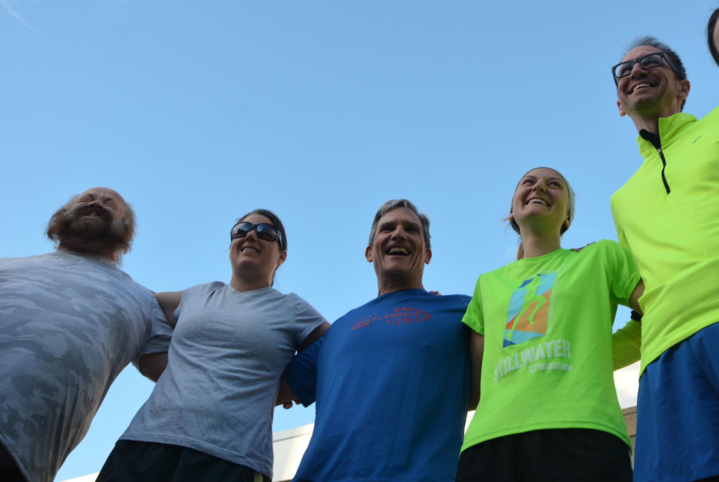 CEO Tim Marx, center, jogs weekly with a group that includes employees, clients and volunteers. He lauded partnerships and innovation in making a difference.