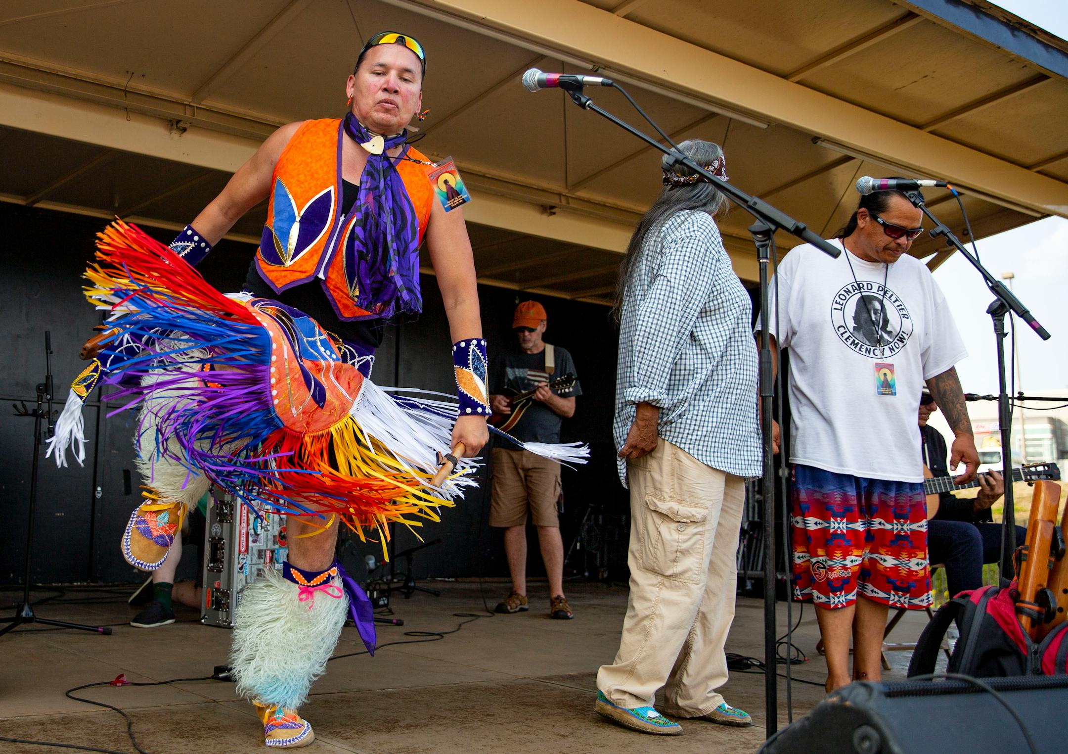 Samsoche Sampson danced while Keith Secola, an indigenous performer from Cook, Minn. , performed on the side stage at the Water is Life Festival on Wednesday.