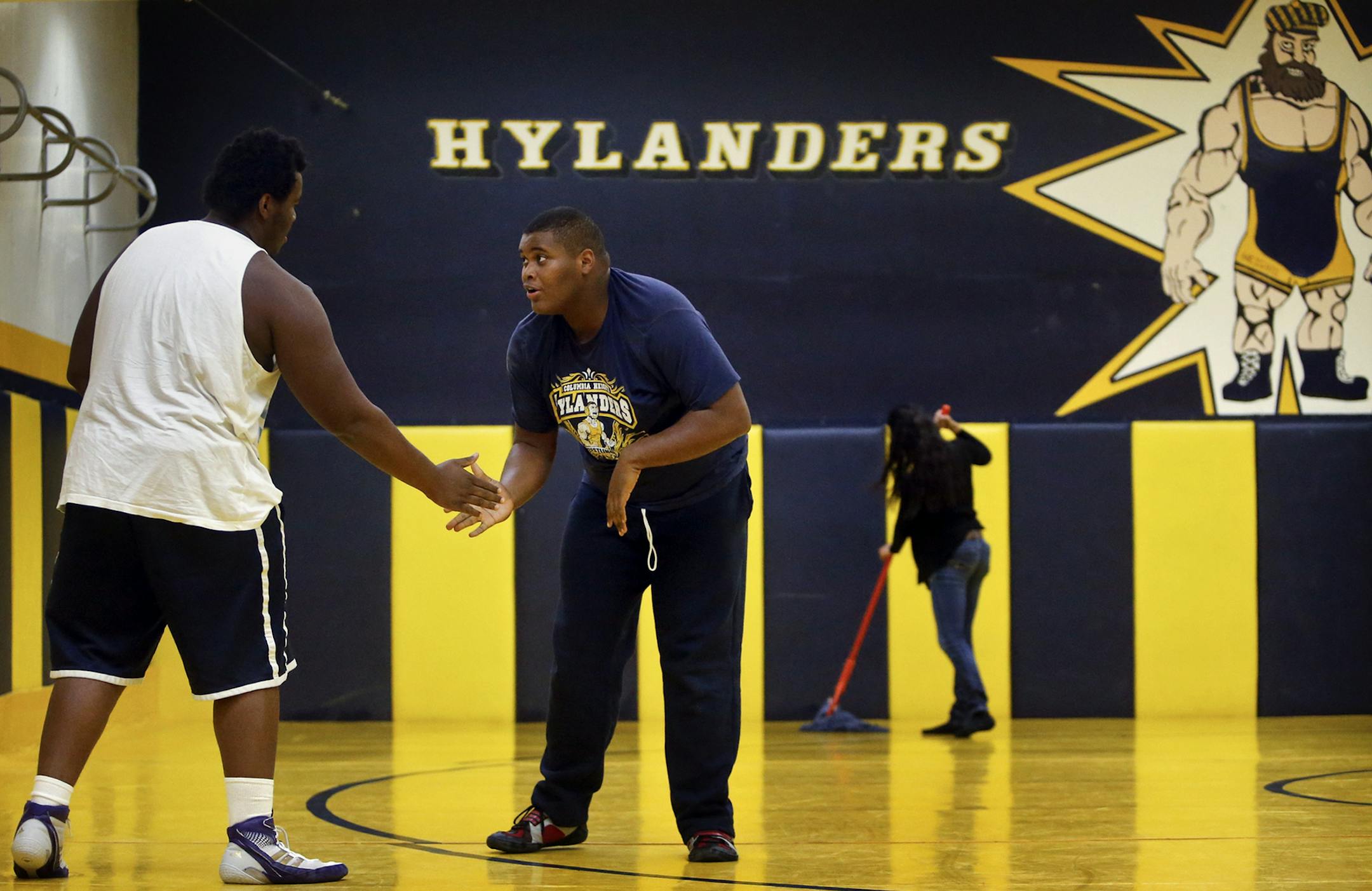 Heavy weight wrestler Brady Netland has shed more than 60 pounds since last year and gotten his weight under the 285 pound wrestling maximum and will challenge for a varsity spot. Here, Netland, middle, worked out with fellow heavy weight Leandre Bauswel, left, during practice Wednesday, Nov. 20, 2013, at Columbia Heights High School in Columbia Heights, MN.](DAVID JOLES/STARTRIBUNE) djoles@startribune.com Two years ago, big Brady Netland weighed 305 pounds. Last year for football at Columbia He