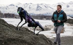 Alaska Department of Transportation program manager Ryan Marlow demonstrates the agency's robotic dog in Anchorage, Alaska, on March 26, 2024. The dev