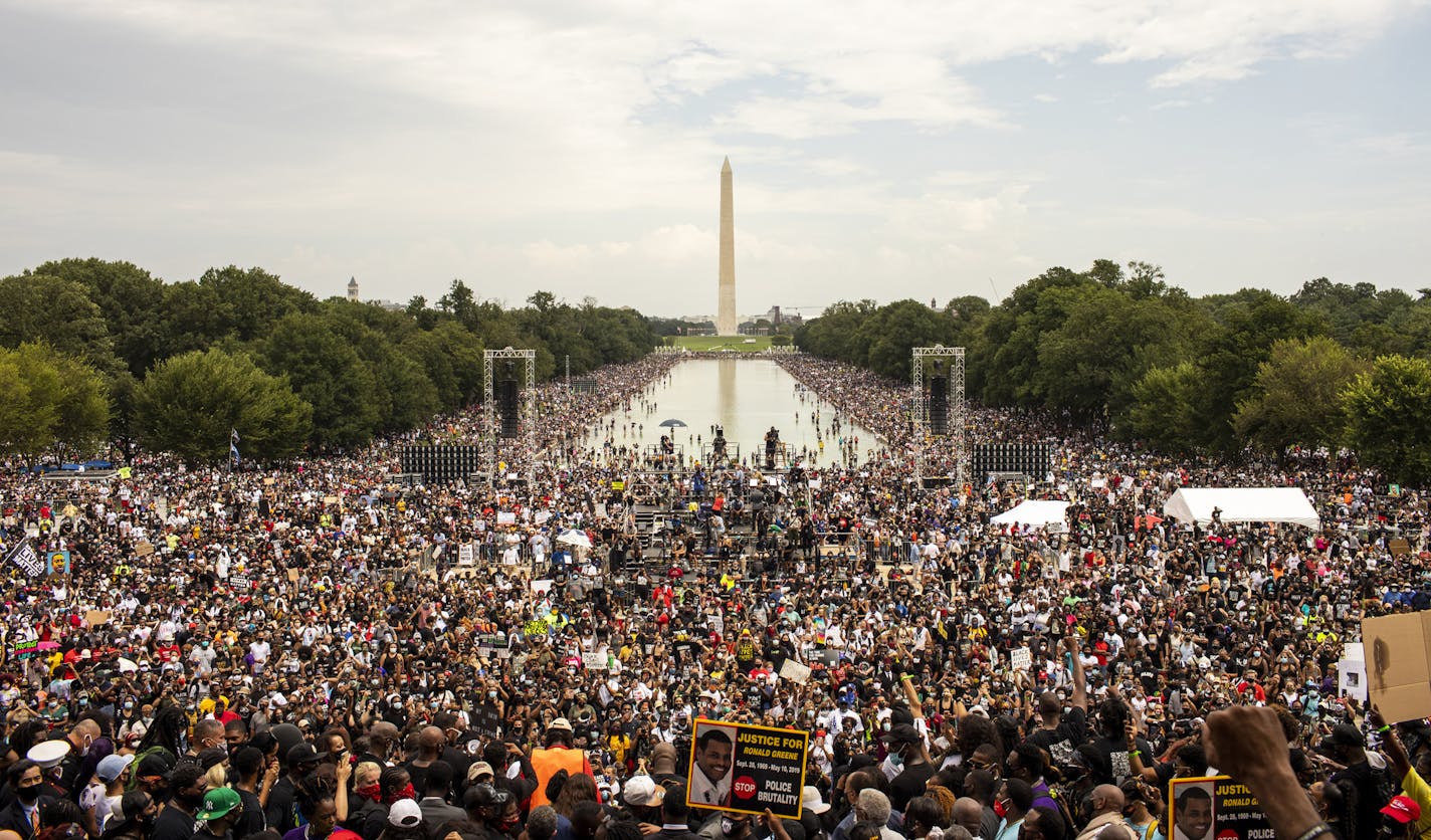 People attend a protest organizers are calling Commitment March: Get Your Knee Off Our Necks, at the Lincoln Memorial in Washington, Friday, Aug. 28, 2020. (Jason Andrew/The New York Times)