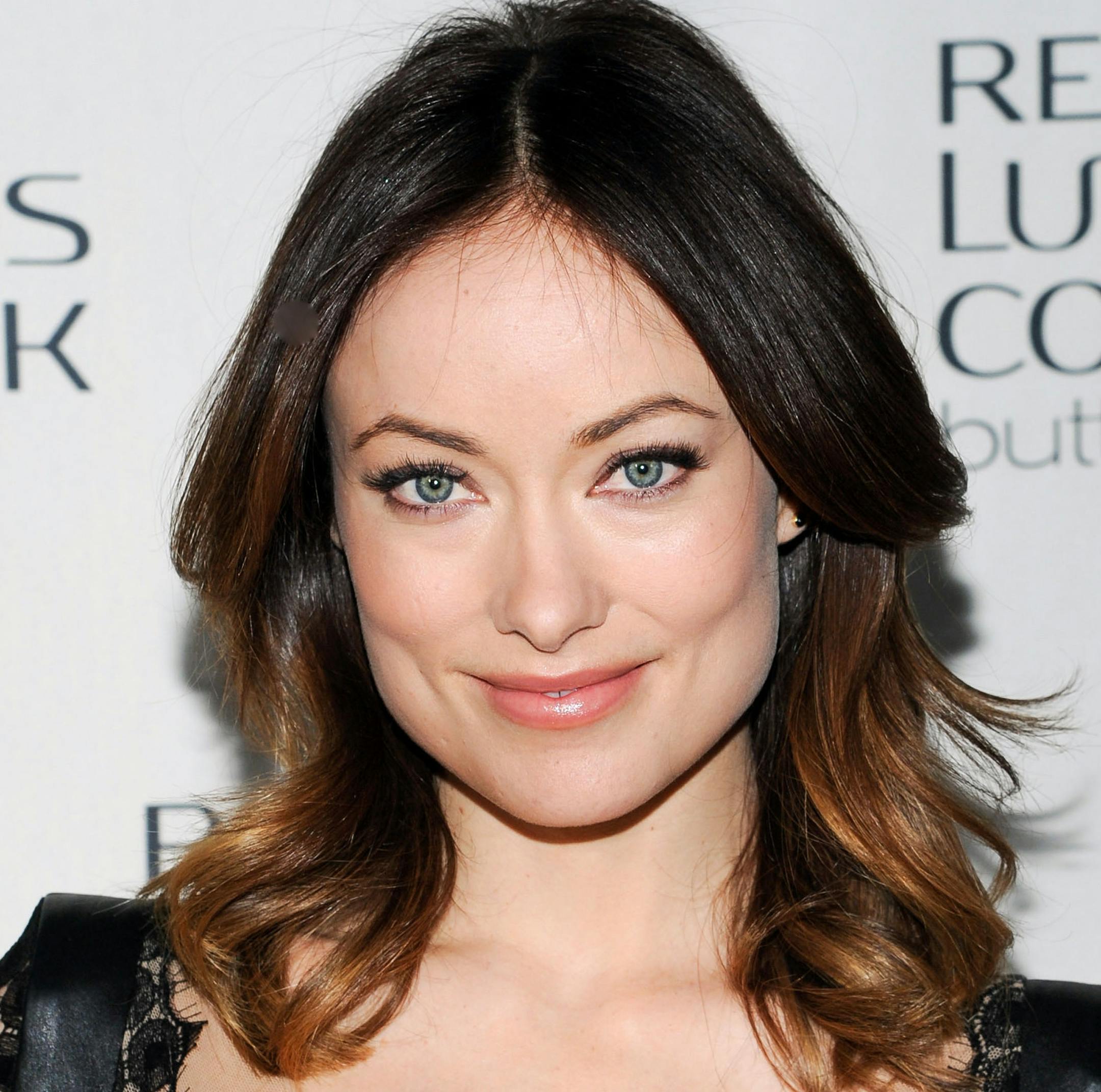 Actress and Revlon global brand ambassador Olivia Wilde poses to promote Revlon Luxurious Colorsilk Buttercream at the Royalton on Thursday, Feb. 7, 2013 in New York. (Photo by Evan Agostini/Invision/AP) ORG XMIT: MIN2013031309161133