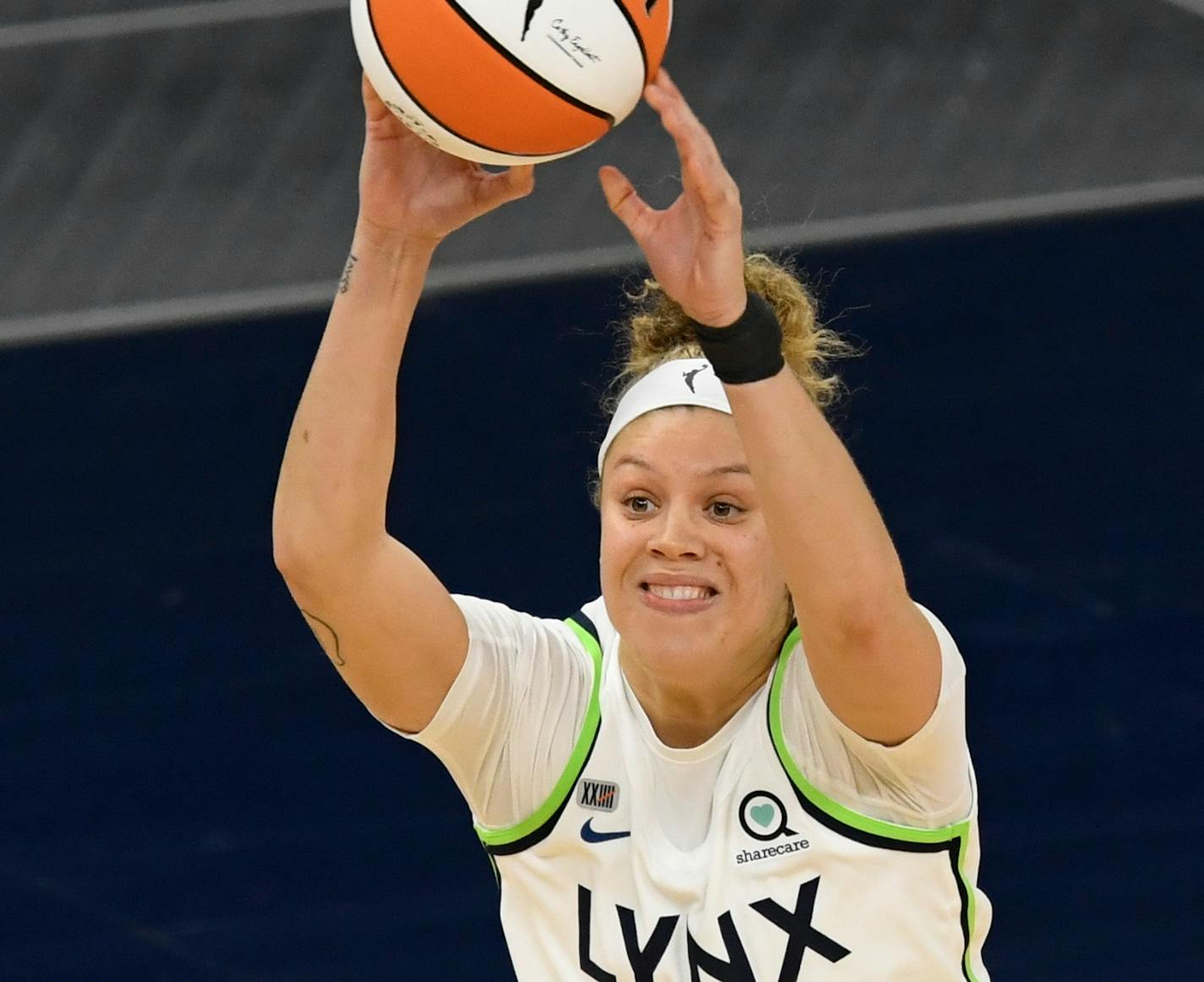 Minnesota Lynx guard Rachel Banham (15) passes the ball against the Phoenix Mercury during a WNBA basketball game, Friday, May 14, 2021, in Minneapolis. (AP Photo/Hannah Foslien)