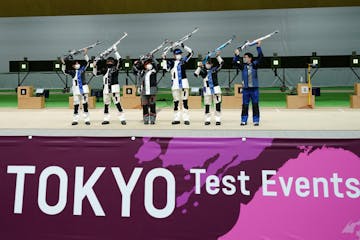 Winning athletes pose after the finals of the 10m Air Rifle Mixed Team competition during the Tokyo 2020 Olympic Game Shooting test event Tuesday, May