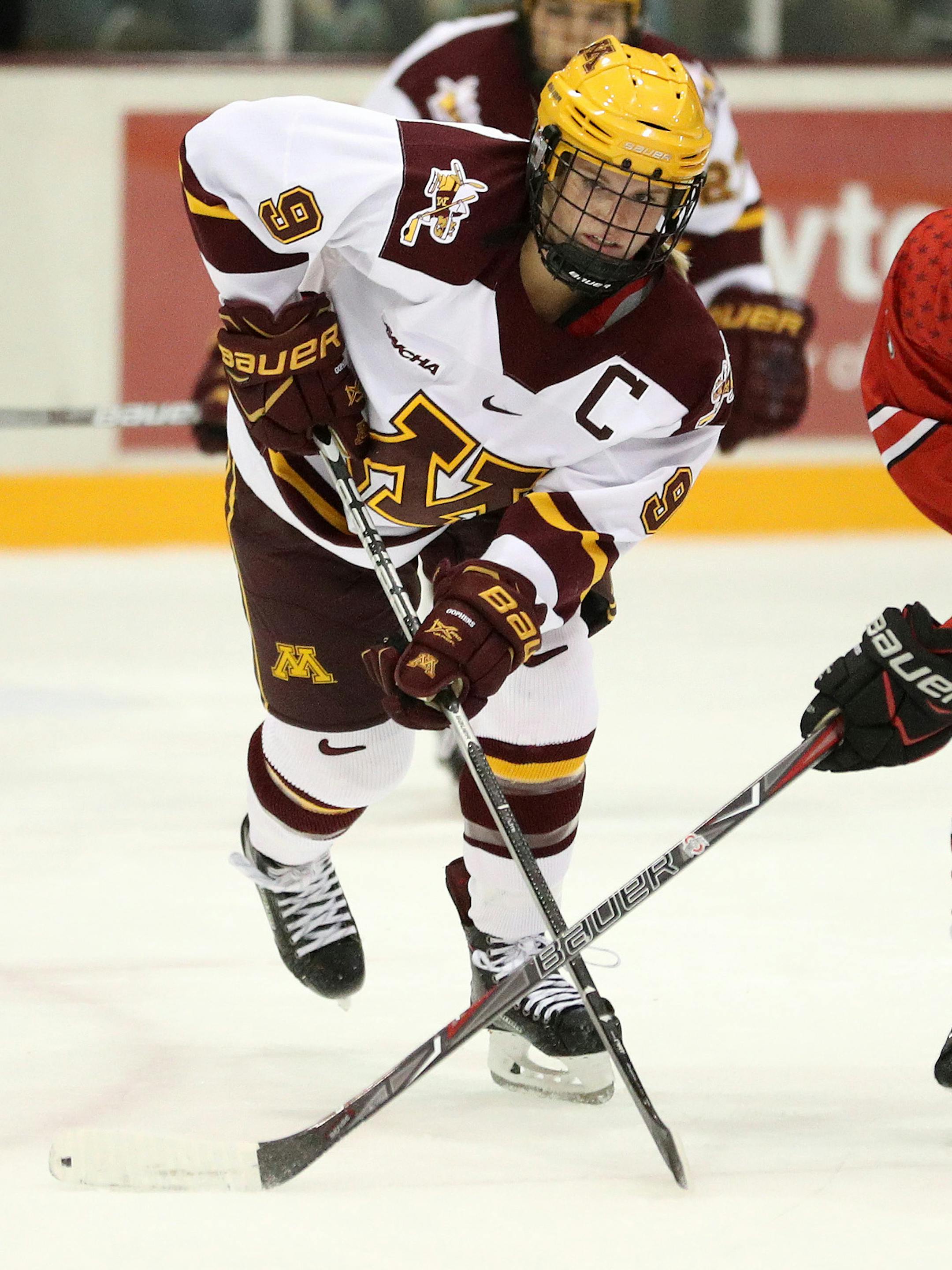 Minnesota Golden Gophers defenseman Sydney Baldwin (9) and Ohio State Buckeyes forward Charly Dahlquist (5) raced for a loose puck in the first period. ] ANTHONY SOUFFLE ï anthony.souffle@startribune.com Game action from an NCAA women's ice hockey match between the Minnesota Golden Gophers and the Ohio State Buckeyes Friday, Oct. 6, 2017 at Ridder Arena in Minneapolis. ORG XMIT: MIN1710062012240697